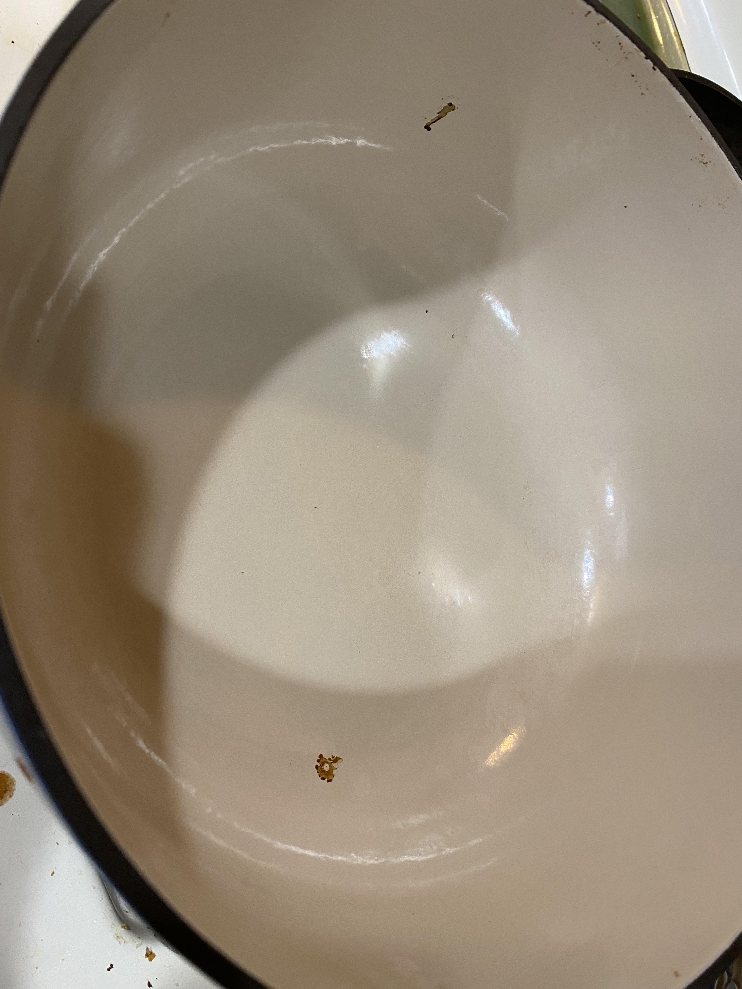 Help! My Lodge Dutch Oven is lightly used but got these black stain, is
