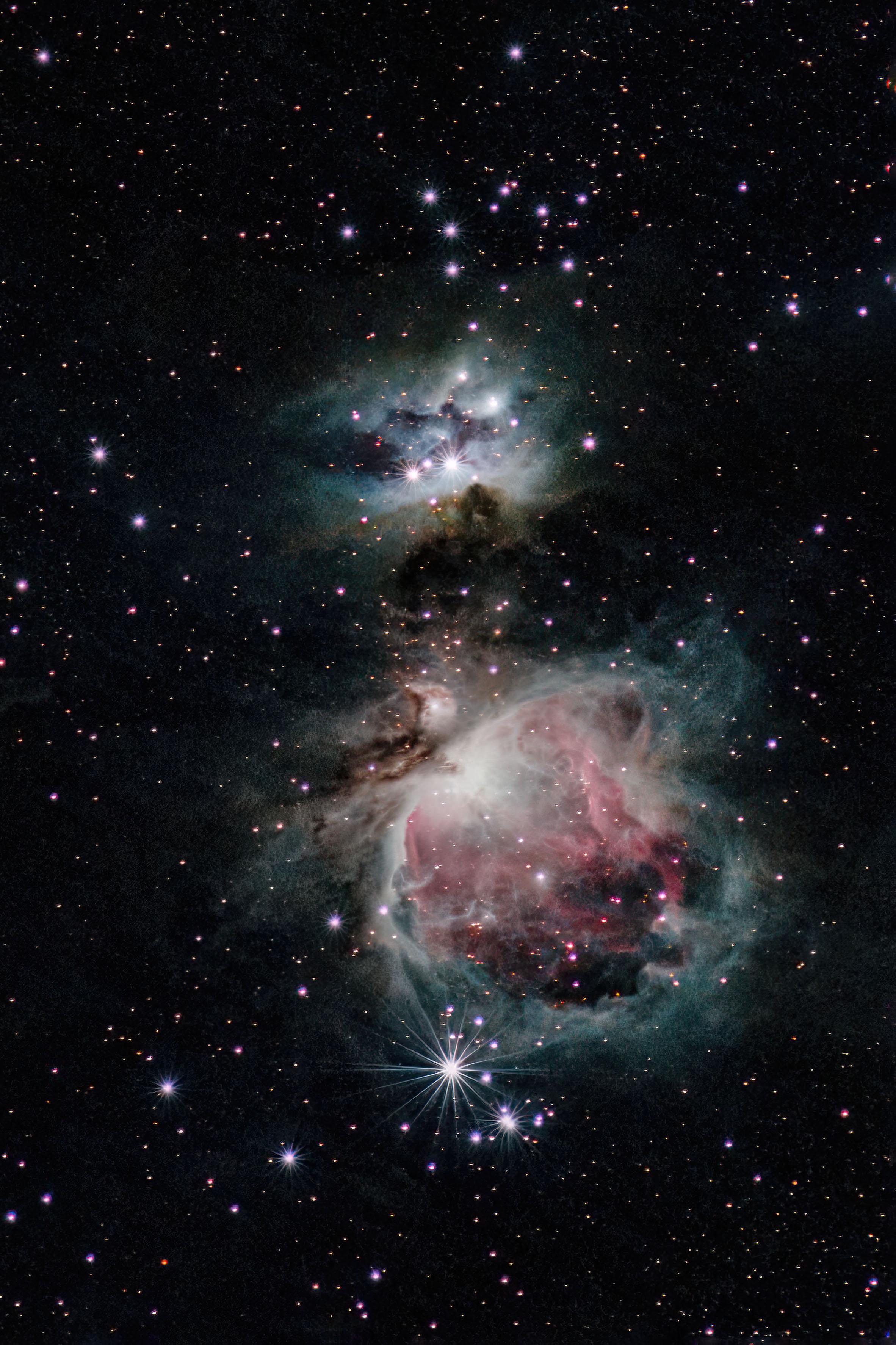 Orion Nebula with a stock DSLR and 180mm lens. r/astrophotography