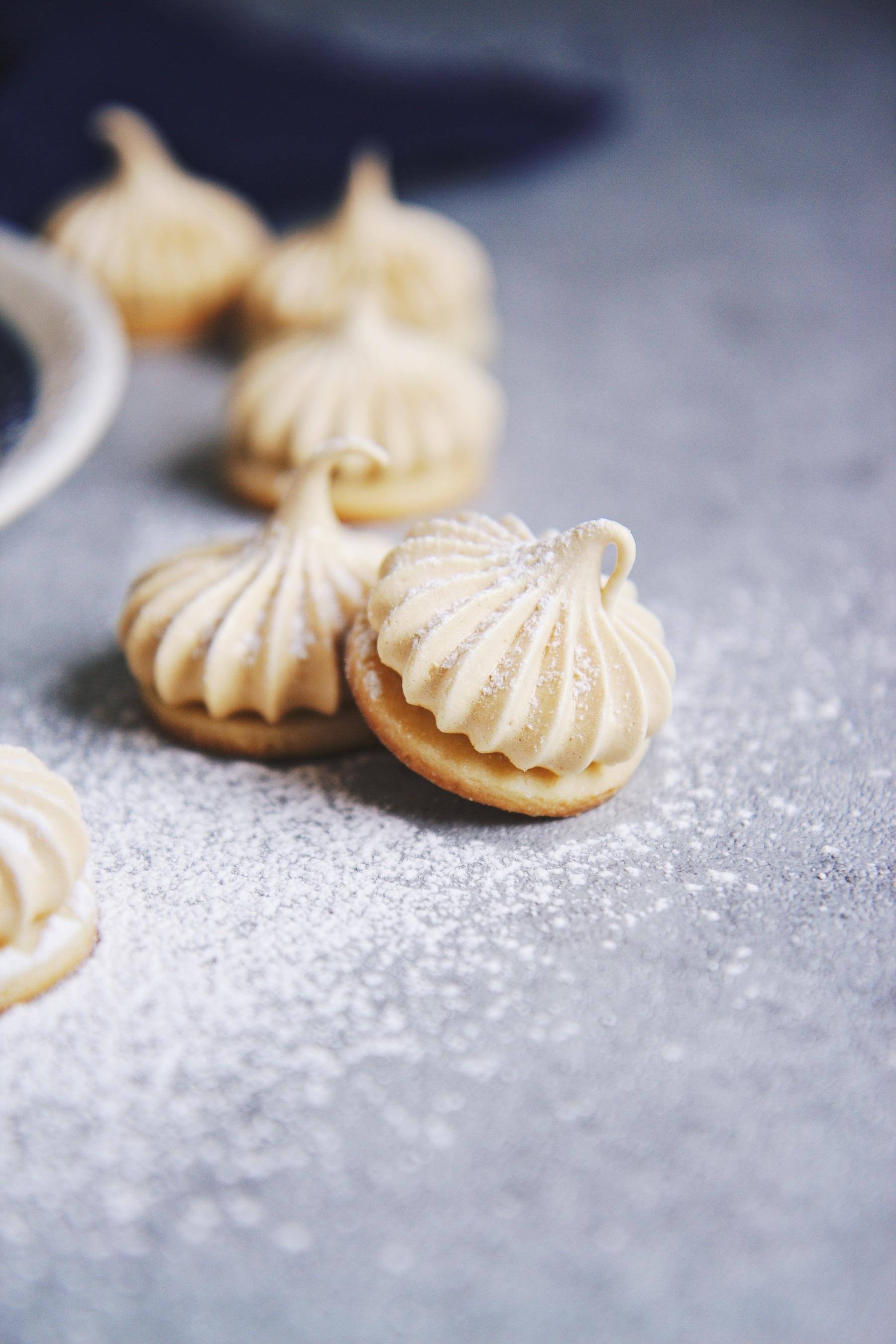 Nutmeg butter cookies with maple meringues (affixed with dark chocolate