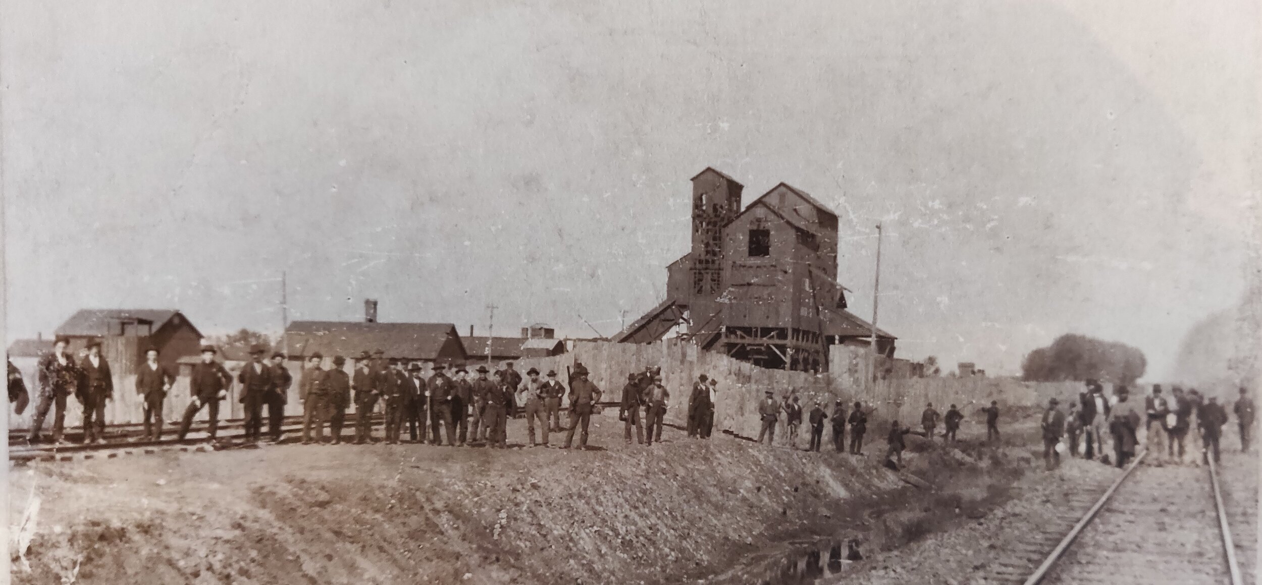 Miners gather at a train station to stop strikebreakers before the
