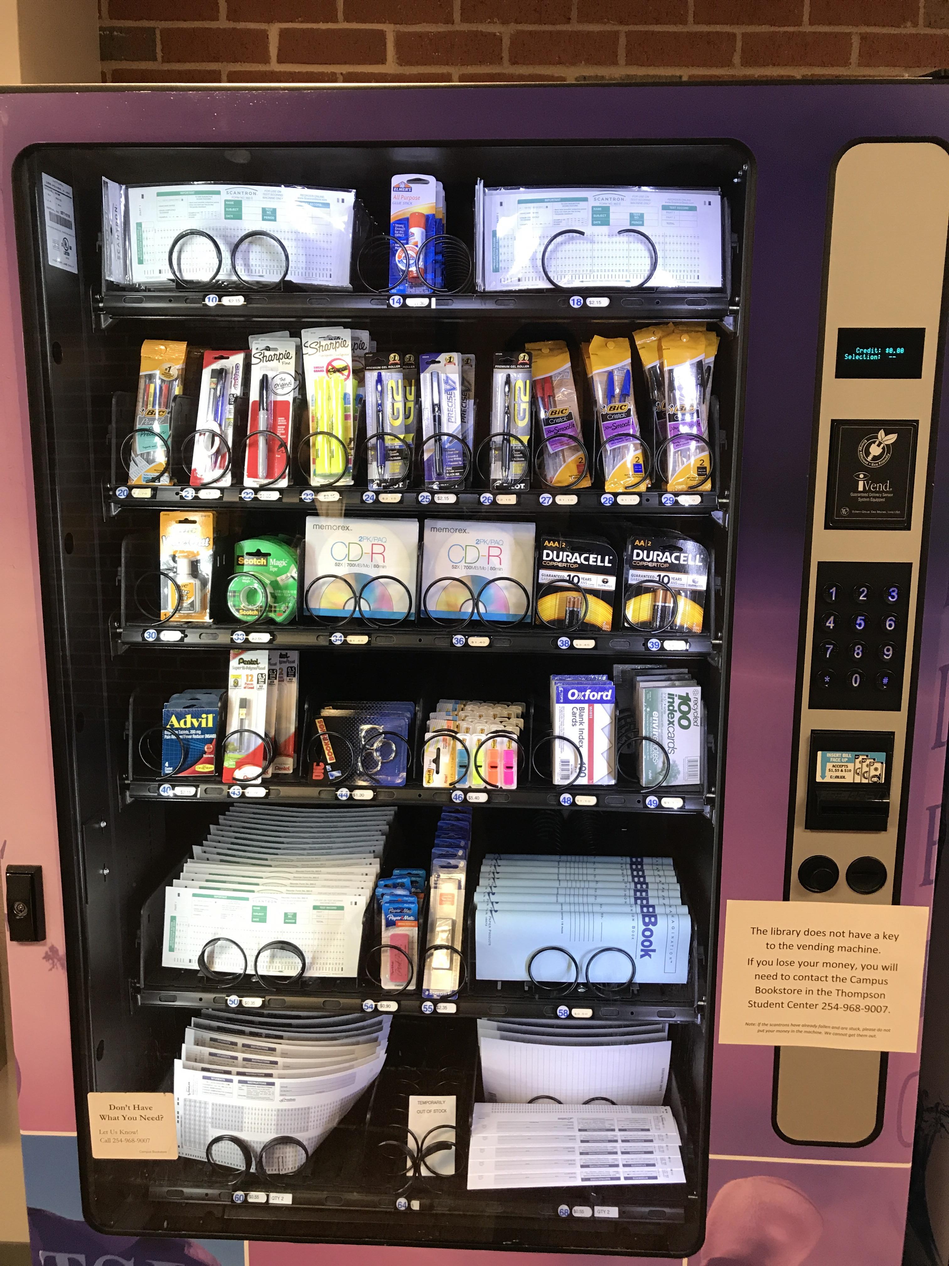 This vending machine sells school supplies including scantrons, glue