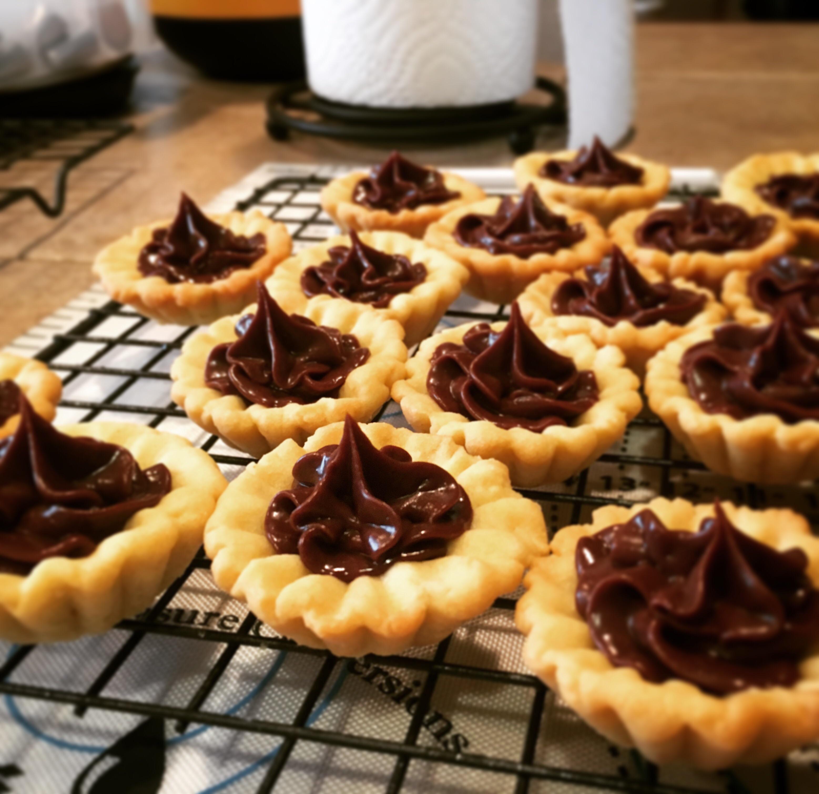 Chocolate ganache tartlets for my coworkers, just because r/Baking