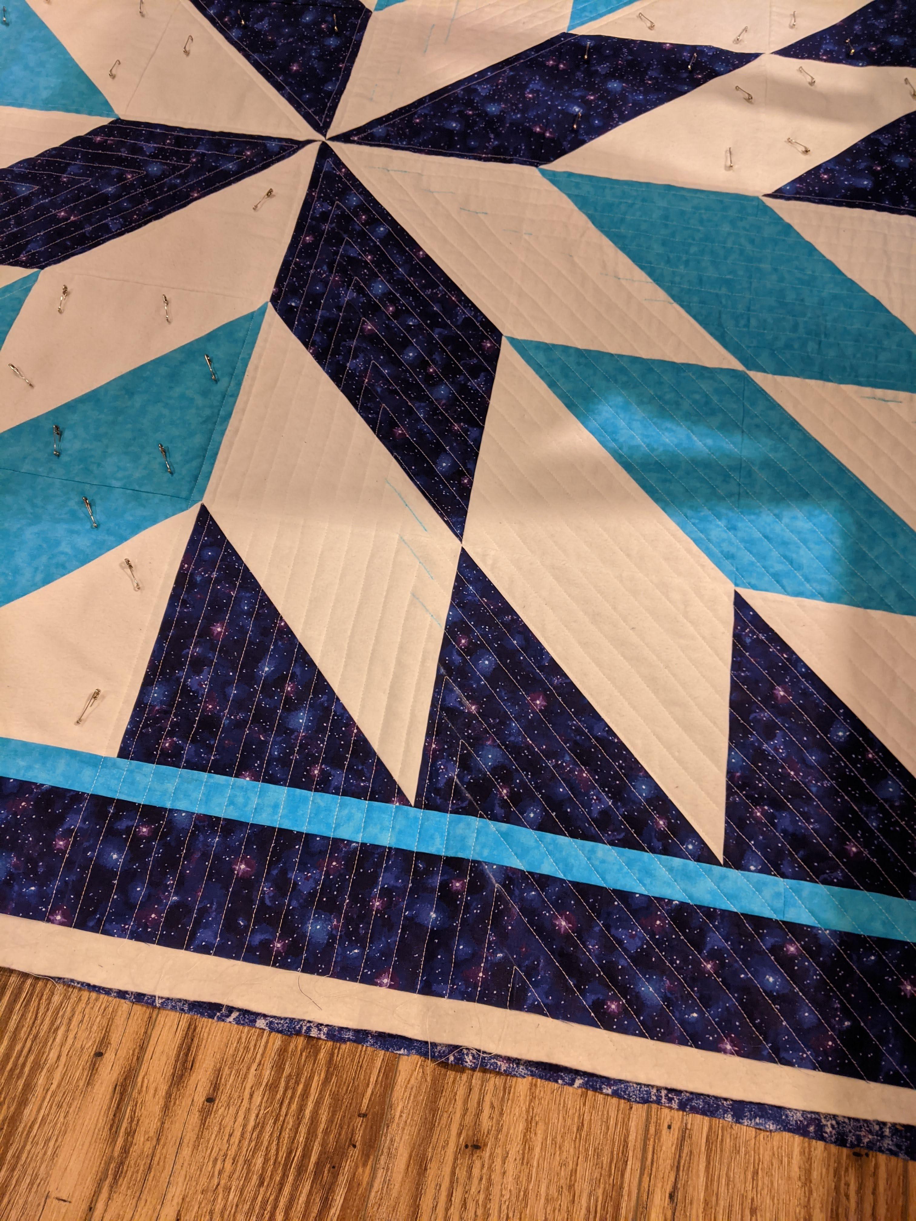 Progress on mu starburst quilt. I'm quilting so much more densely than