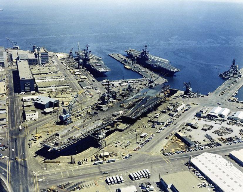 Three US Navy aircraft carriers docked at Hunters Point Naval Shipyard