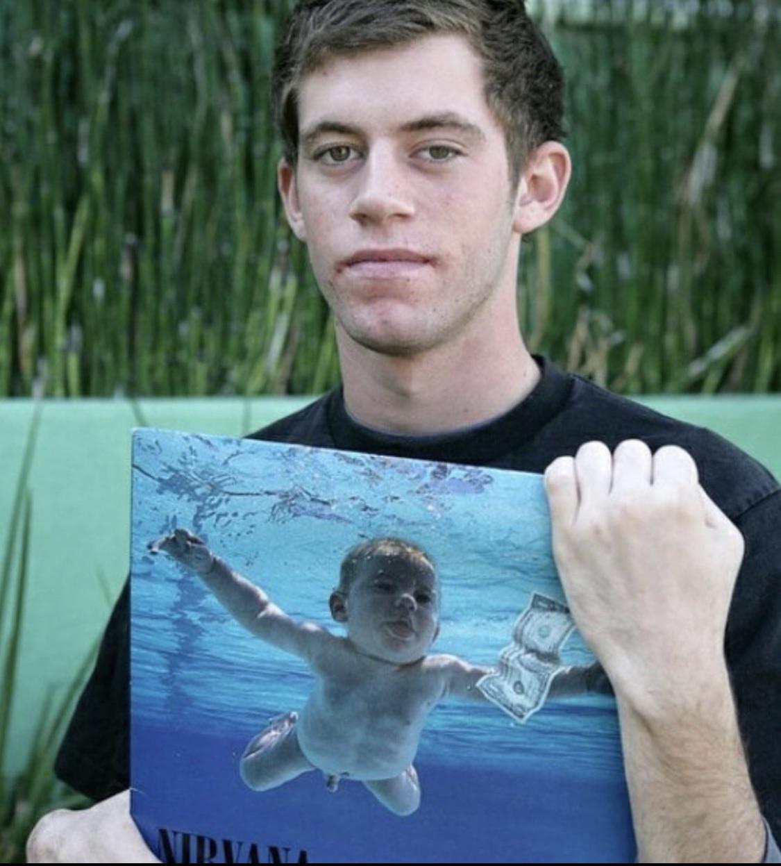 The baby on the cover of Nirvana’s Nevermind, posing with the album in 2015 Damnthatsinteresting