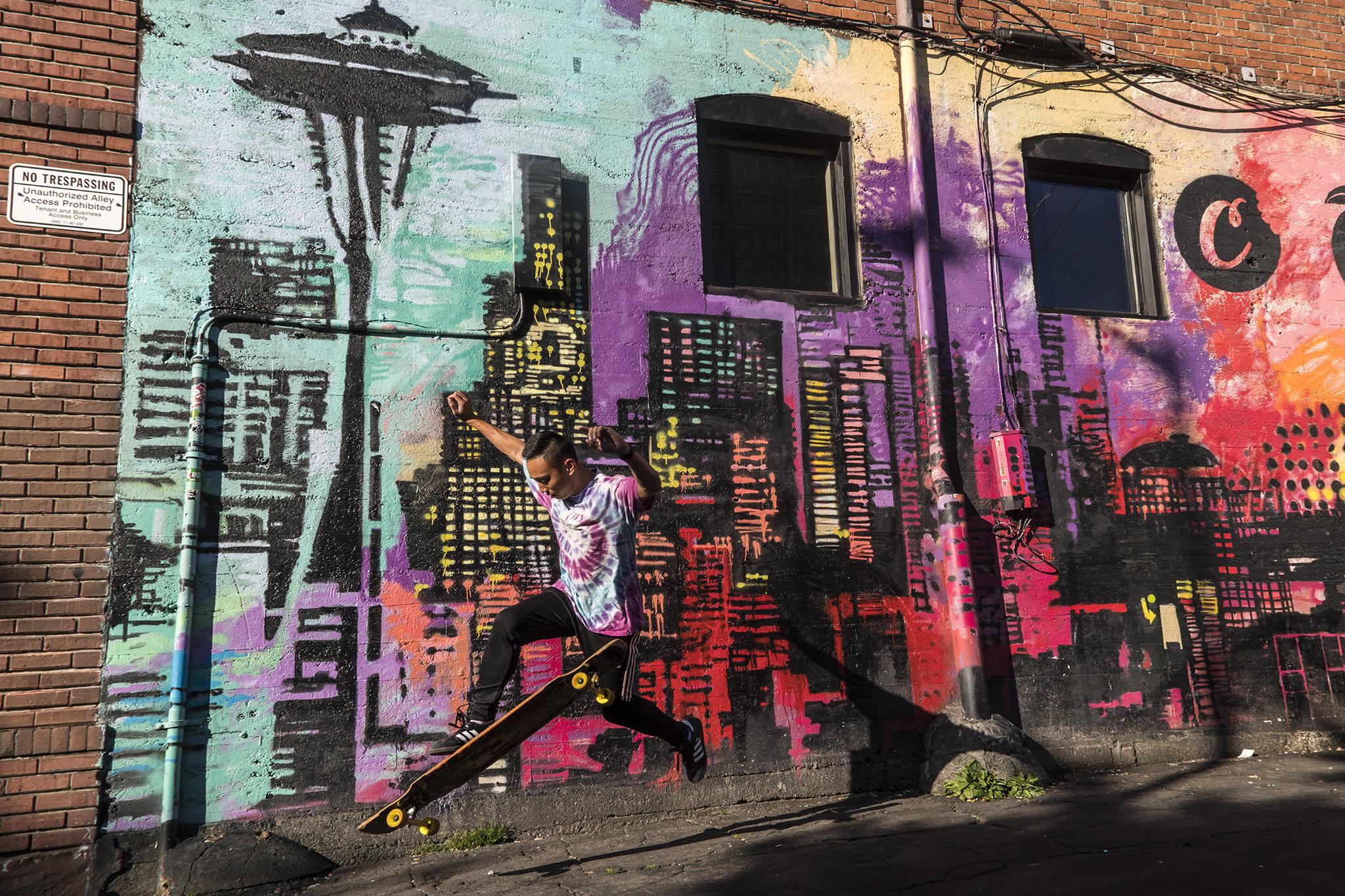 Cruising by murals with Merv in Seattle. r/longboarding