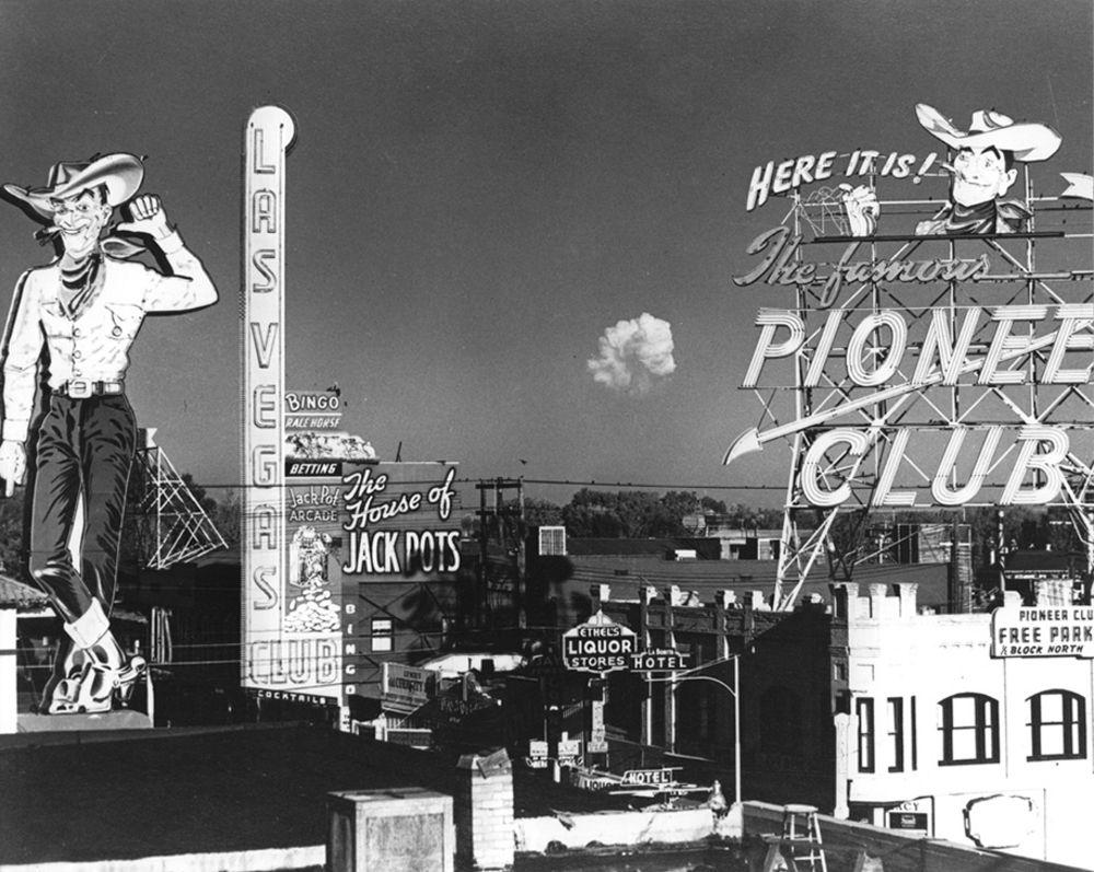 The mushroom cloud from an atomic test is seen from Fremont Street in