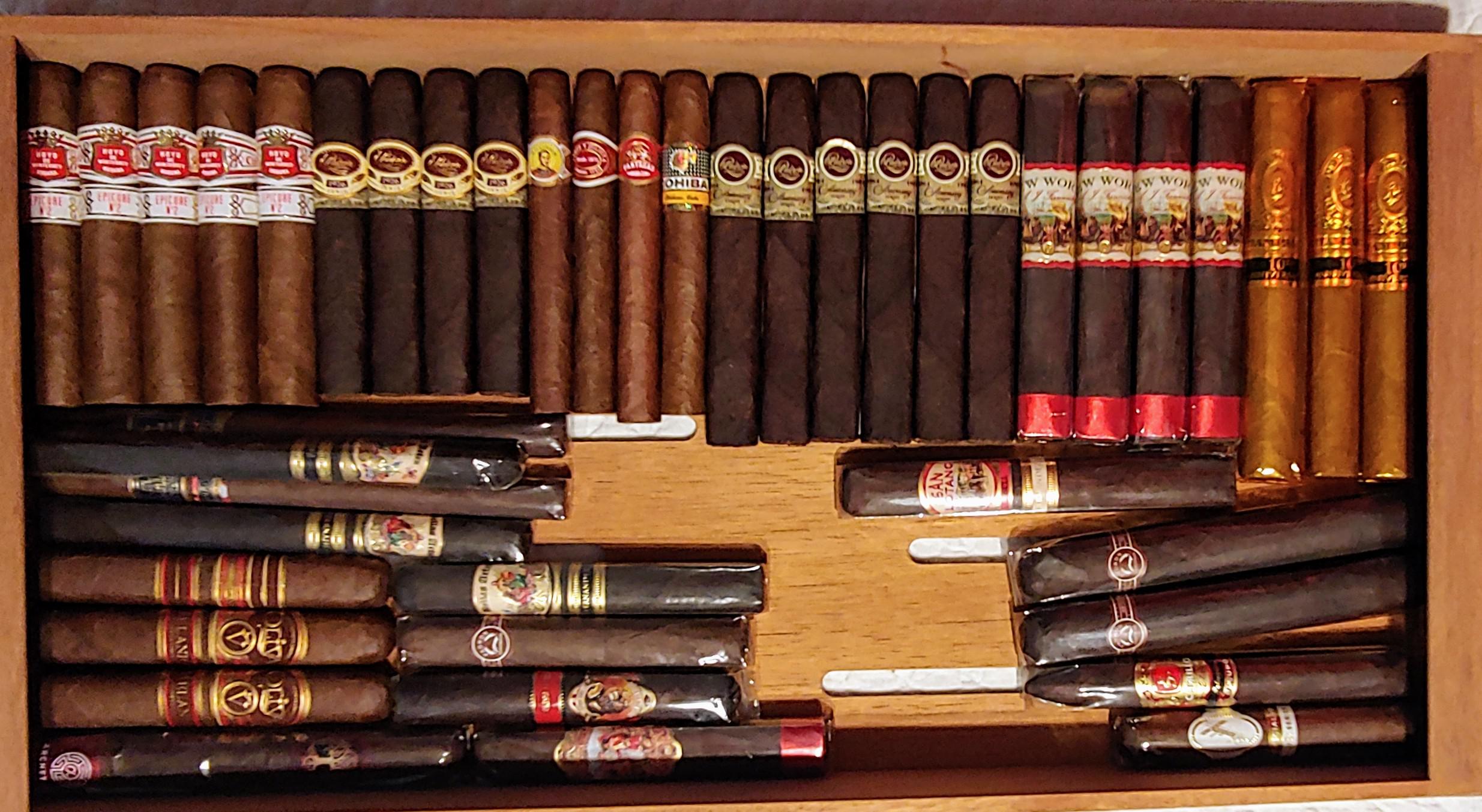 Got an additional humidor seasoned and filled it up. It smells awesome