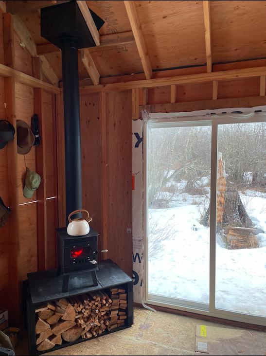 Log burner installed at the cabin staying warm for the last winter