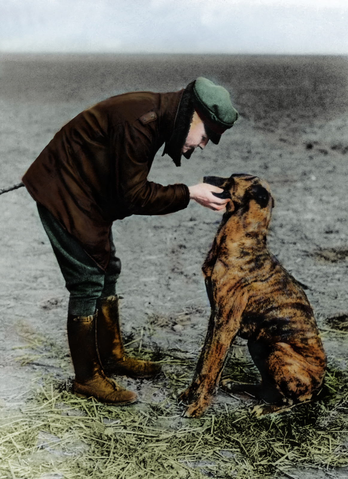 Manfred von Richthofen petting his dog on an airfield, 1916 [1163 x