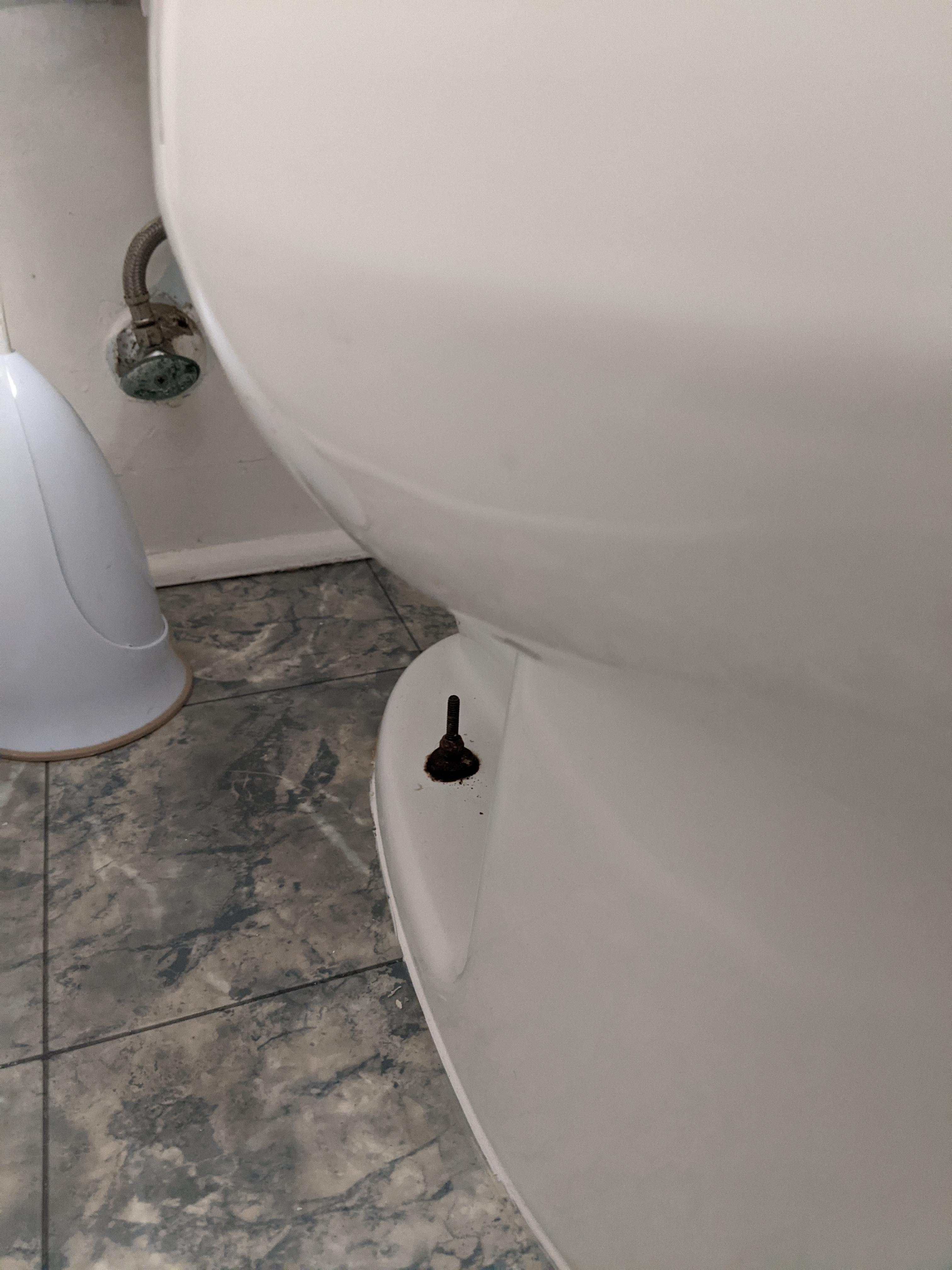 Small amount of water at back, base of toilet and toilet tank keeps filling until I wiggle the