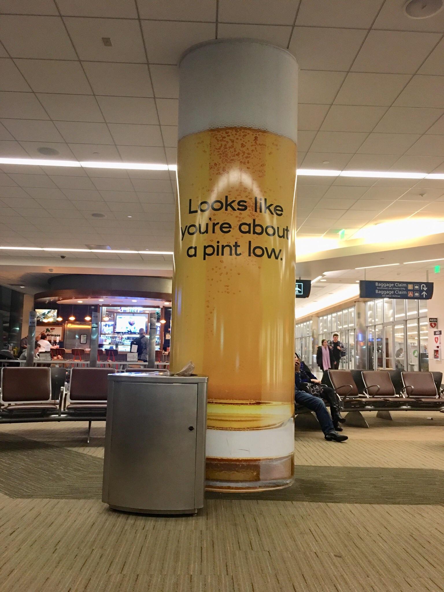 This beer ad on a column at San Jose Airport r/DesignPorn