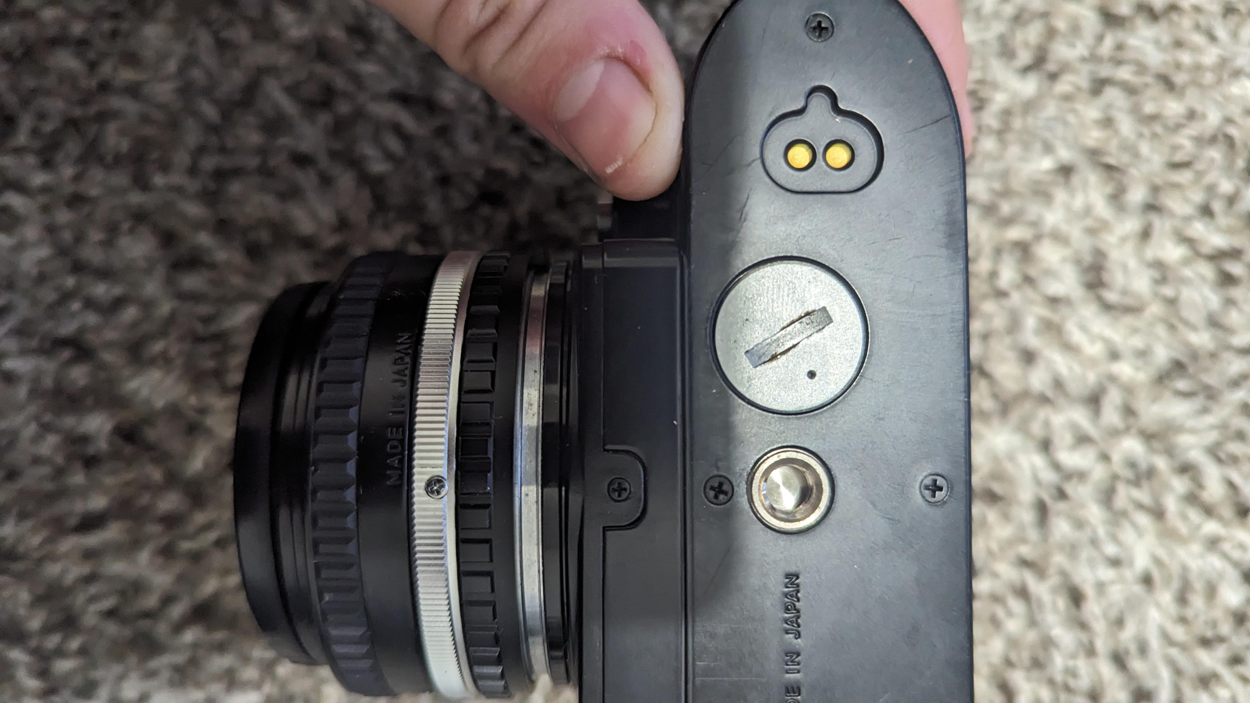 Nikon fg battery compartment cap stuck