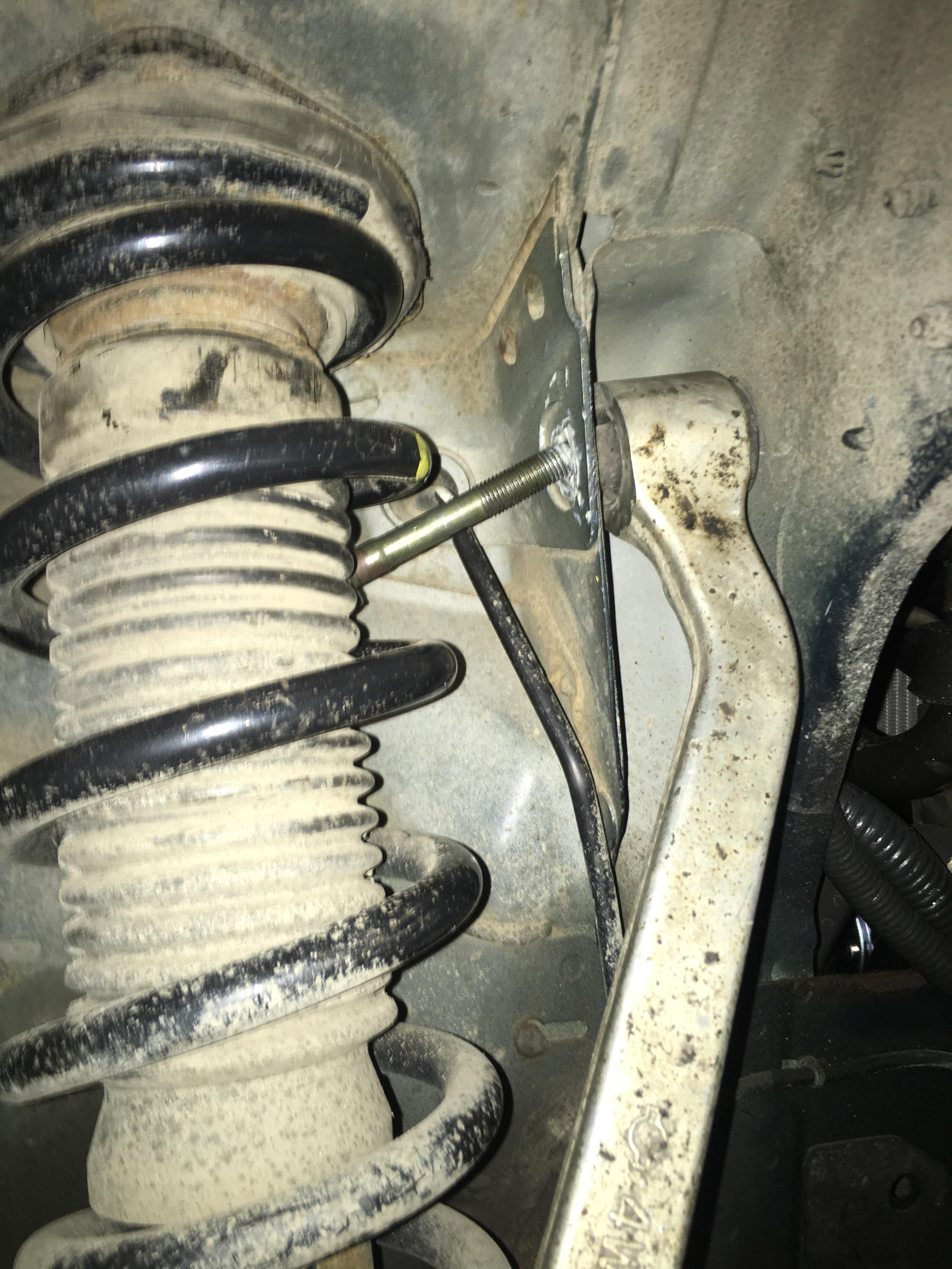 Need help getting this upper control arm bolt in, spring in the way r