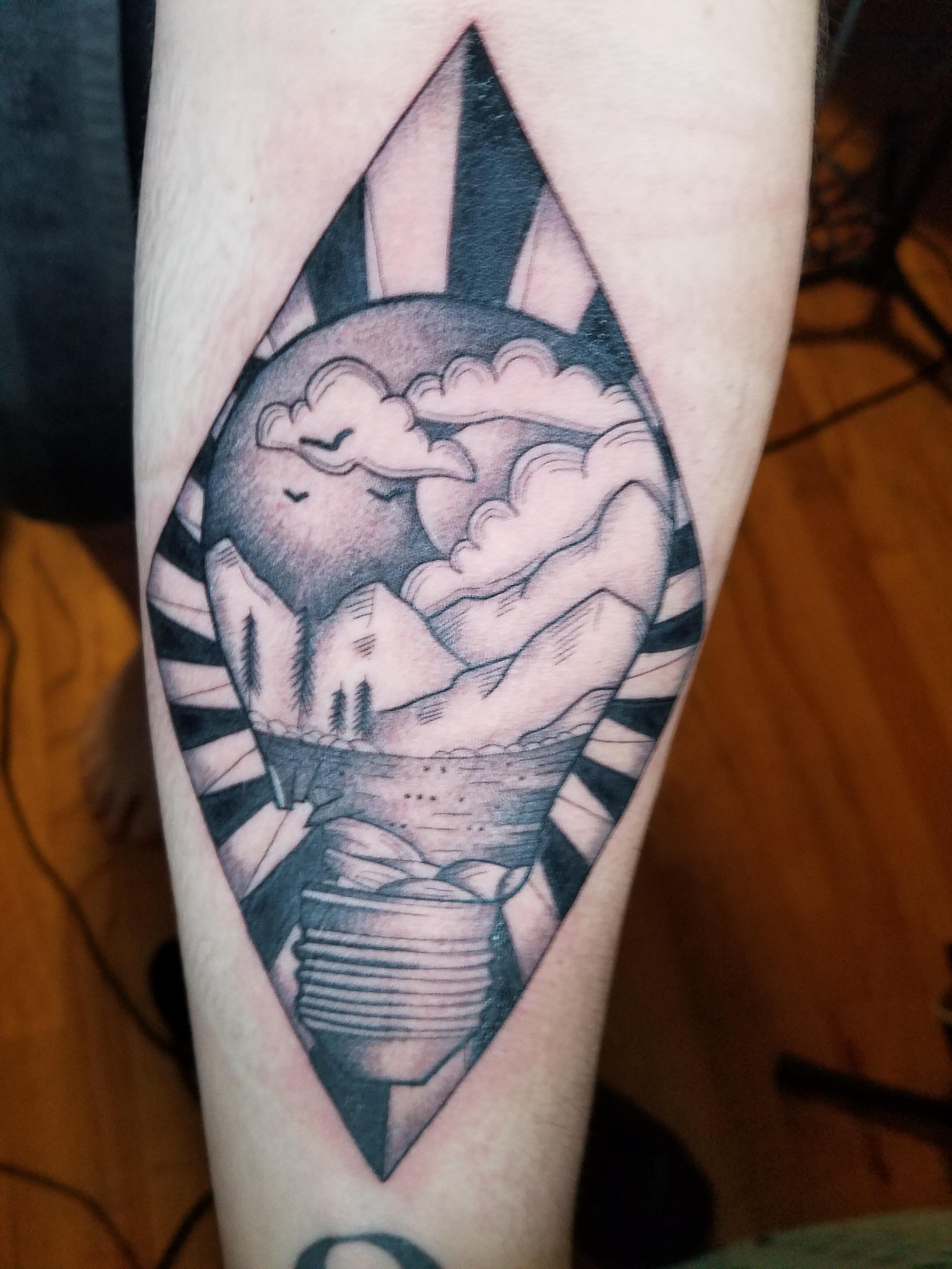 Lightbulb done by Michael Mendoza at Dolorosa Tattoo in