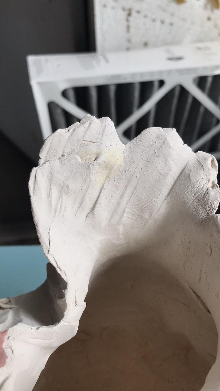 these yellow smudges keep appearing on my bisqueware while glazing