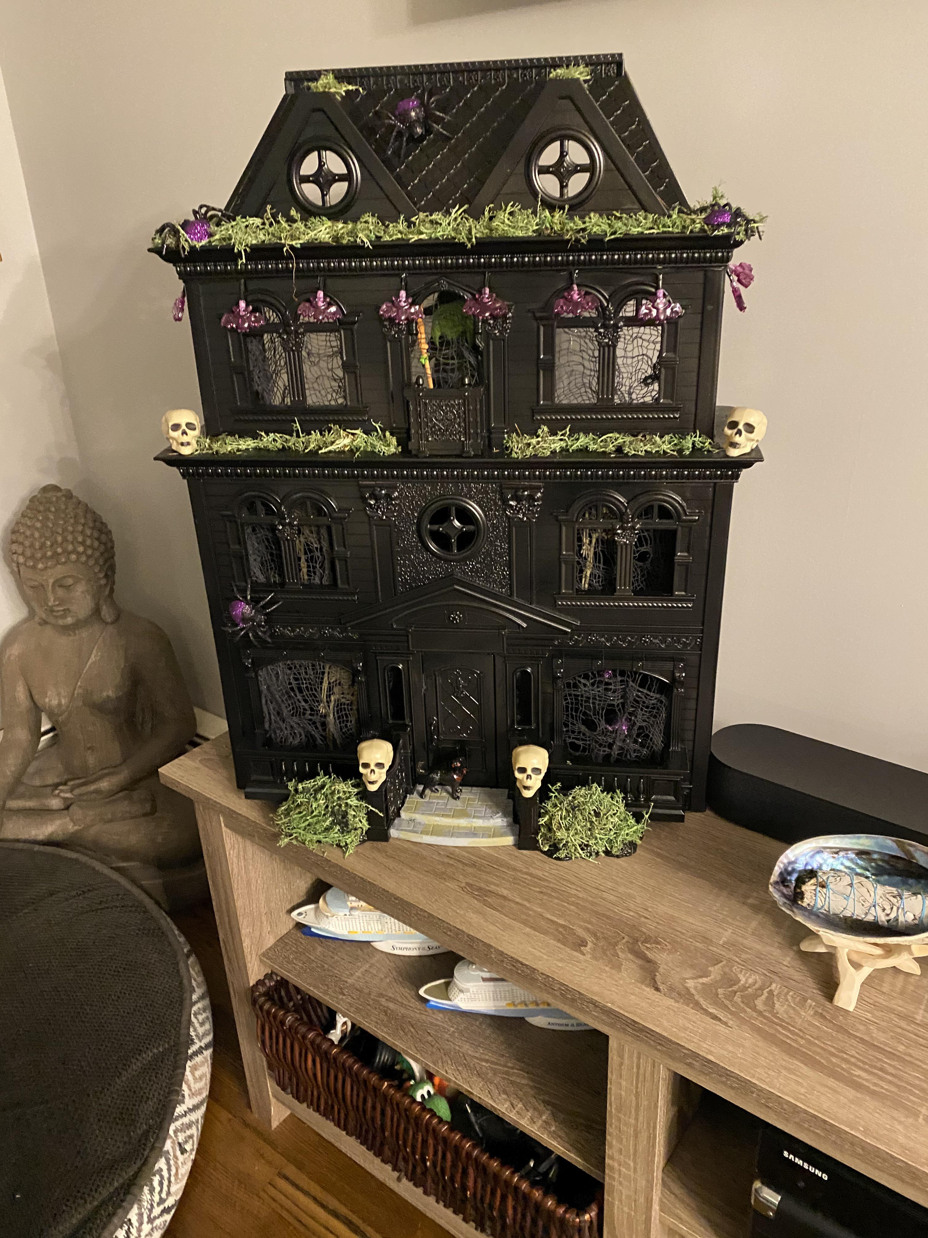 My family made a doll house into a haunted house out of stuff from the