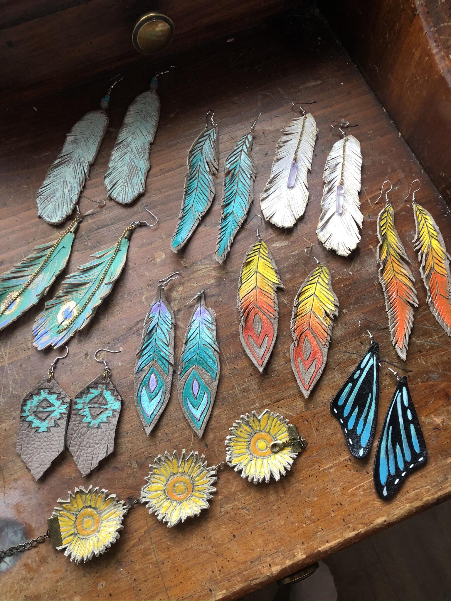 My hand painted leather feather earrings r/crafts