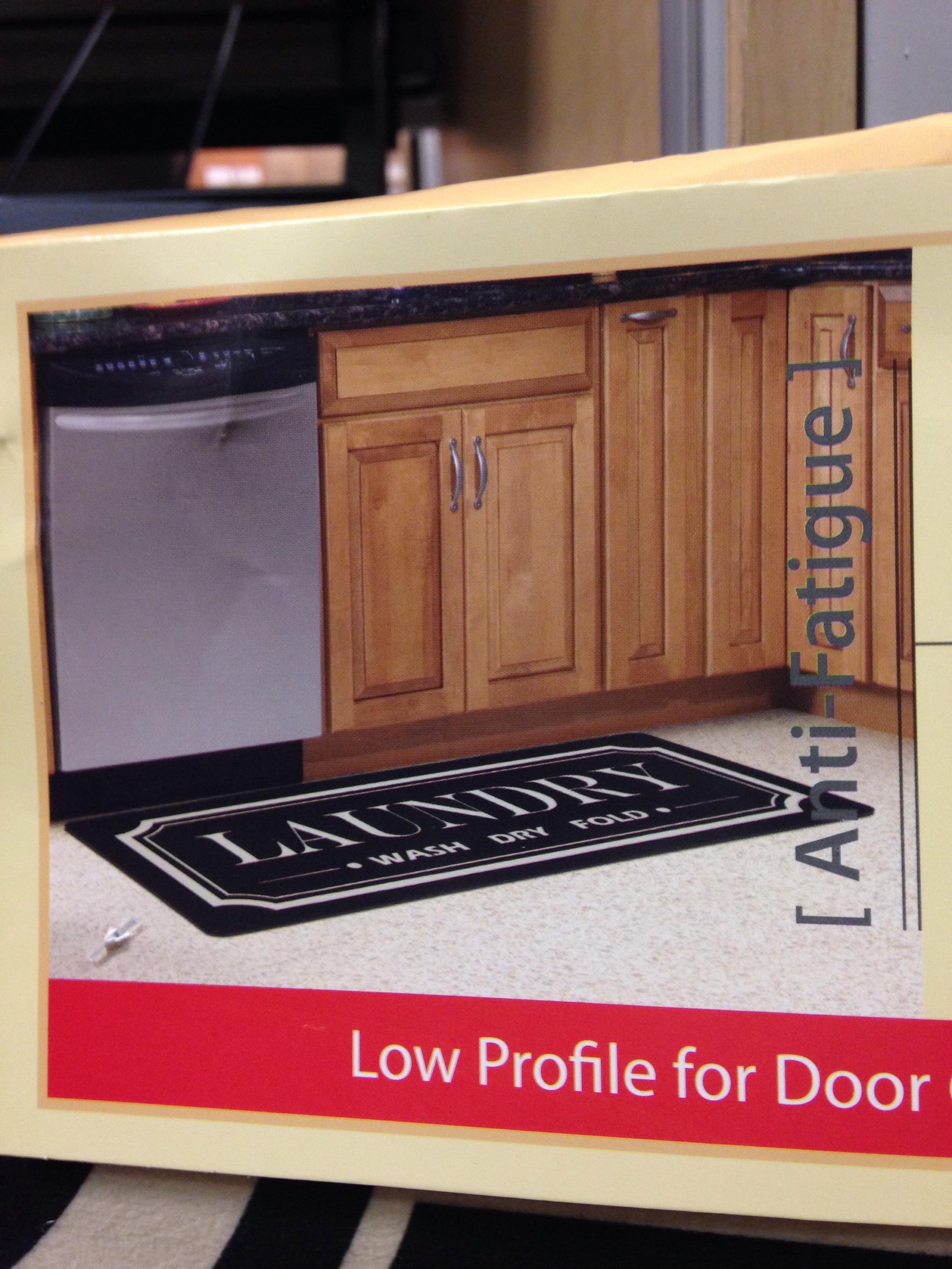 Floormat that says laundry is in front of a dishwasher r