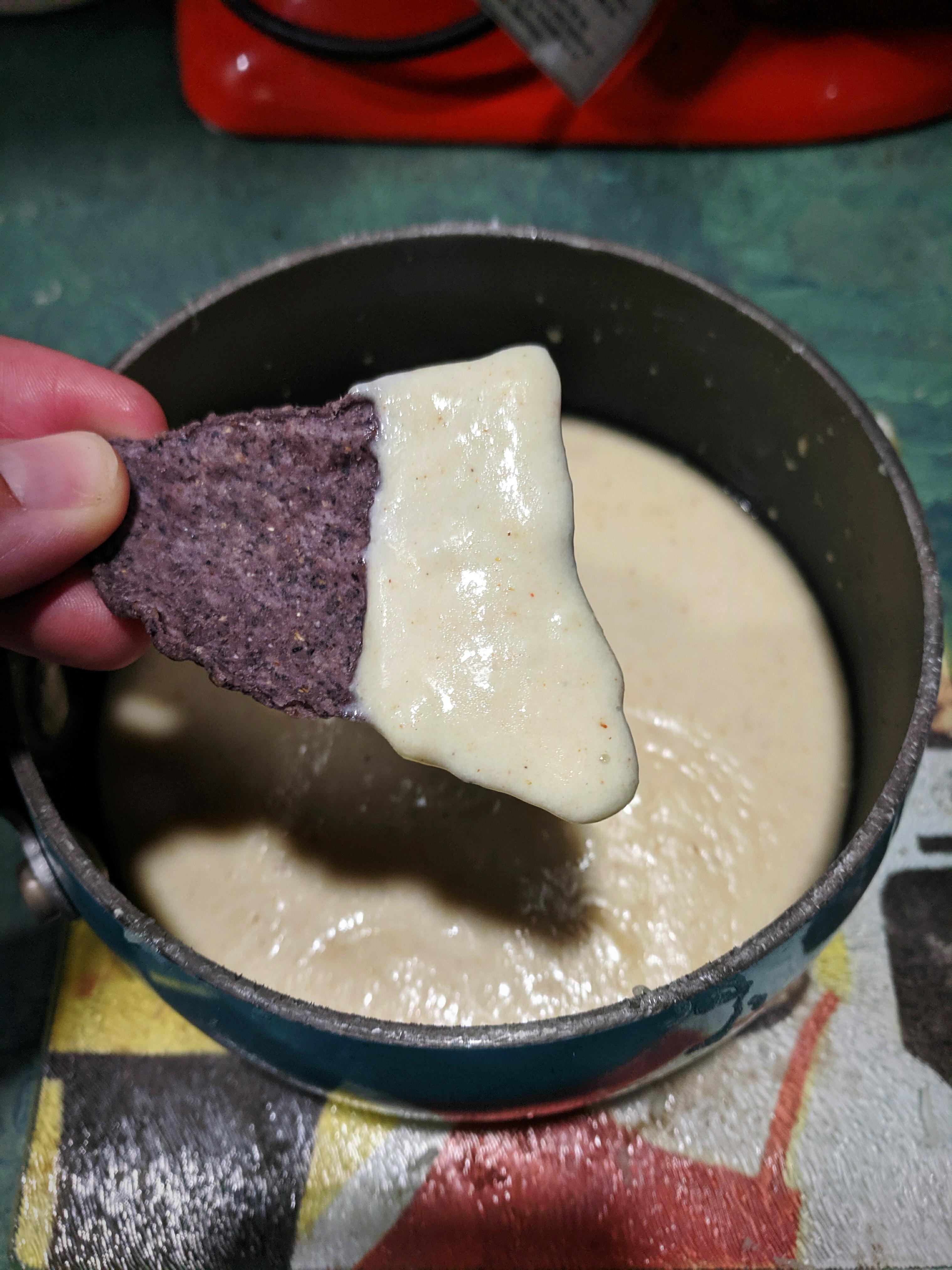 Tortilla chips in a homemade Monterey jack cheese sauce r/munchies