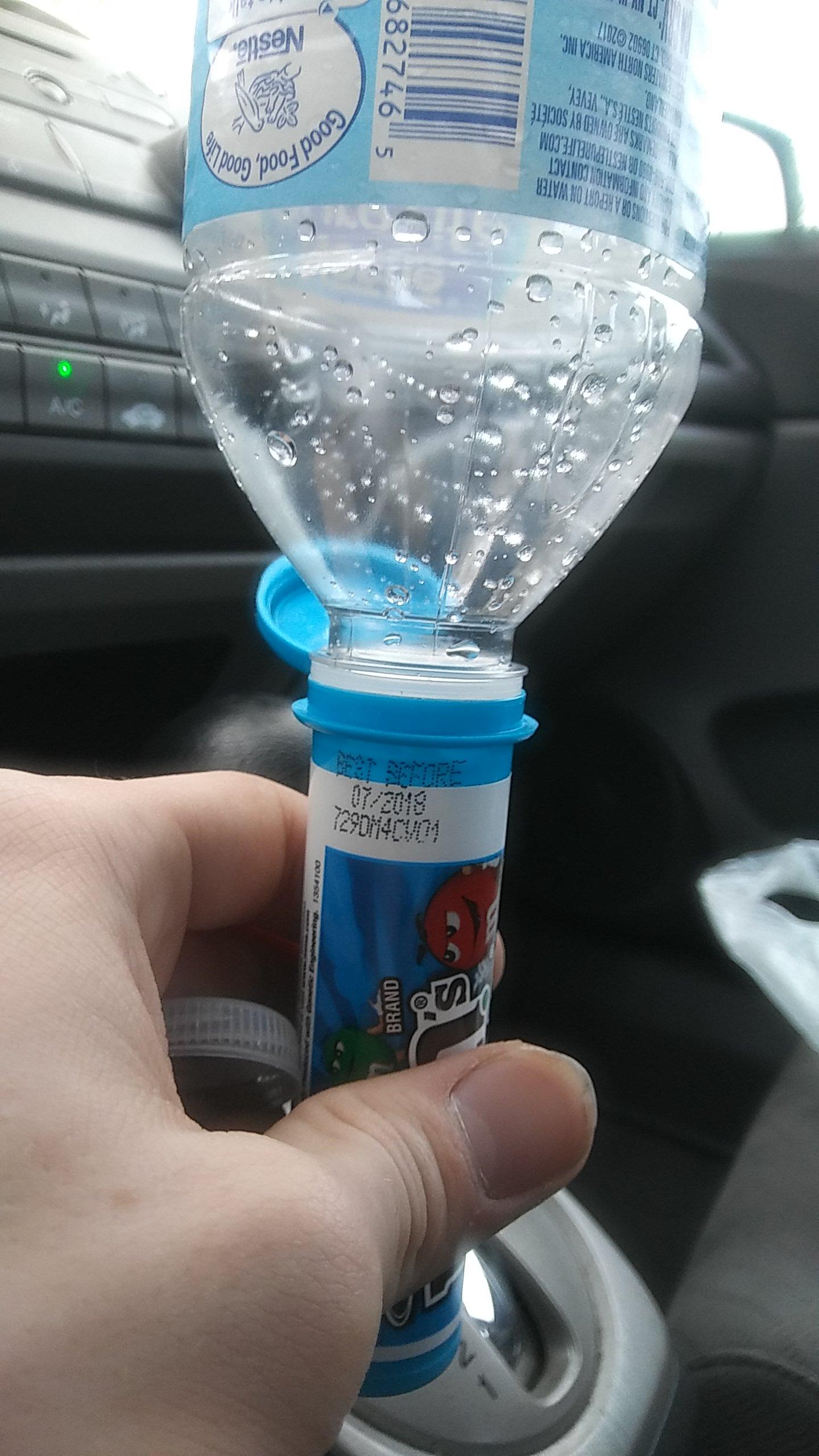 Empty water bottle and a mini m&m tube r/Perfectfit