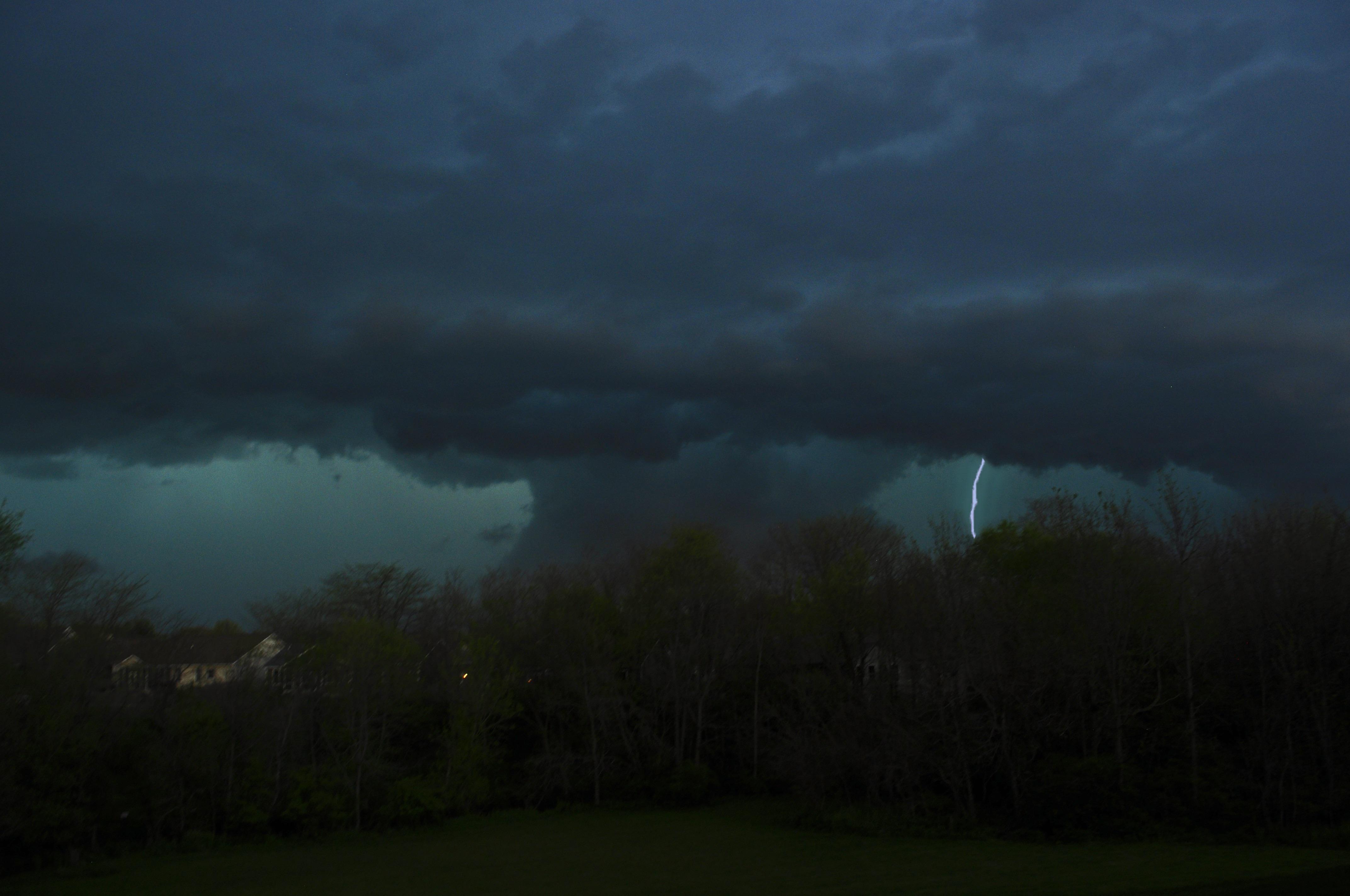 Wall cloud with lightning and a turquoise hail core. Dropped a tornado to my NE in Dawson IL