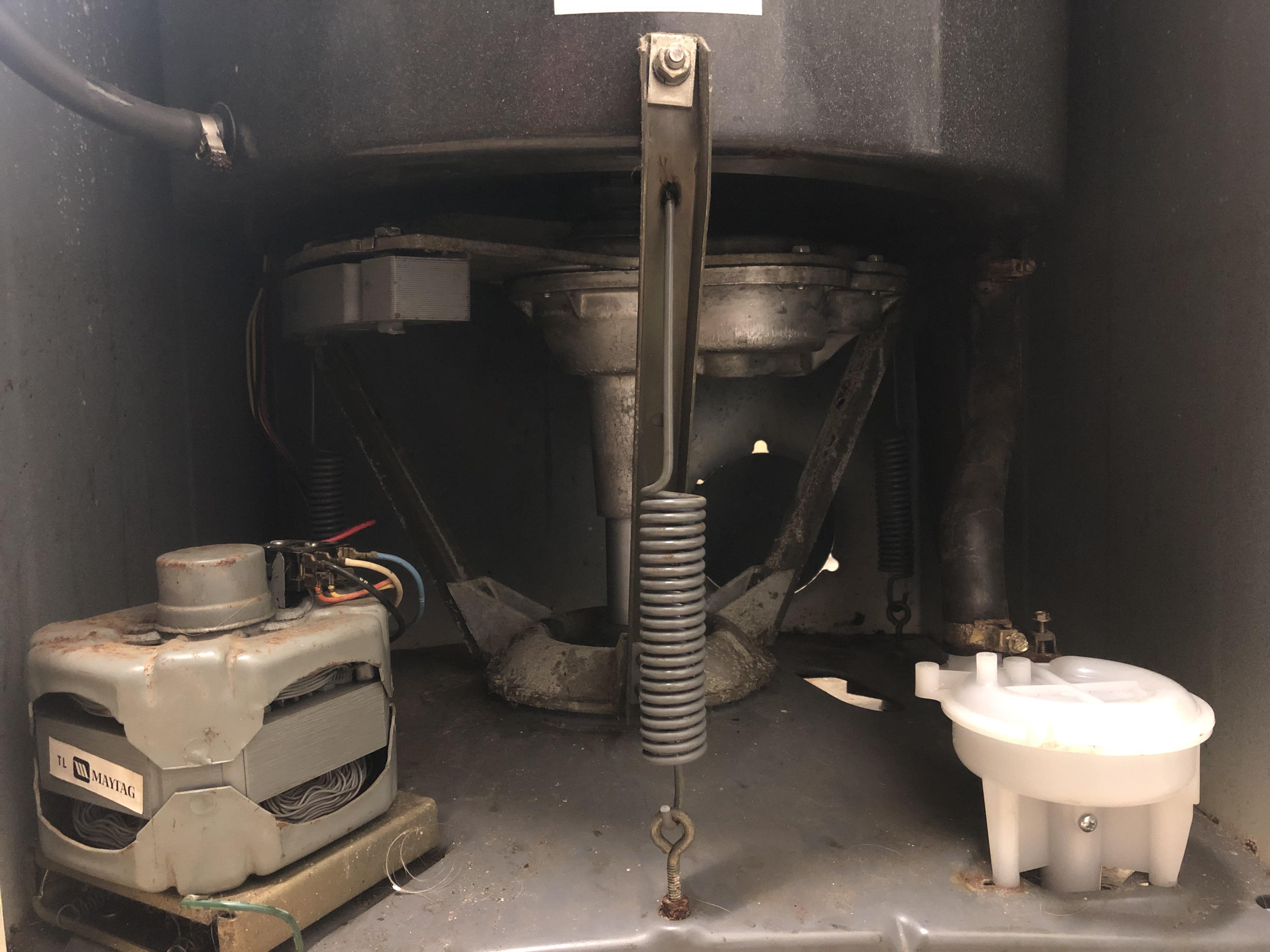 Maytag washer spins slow, has burning smell, trips breaker. Model LA512 Series 04 Serial