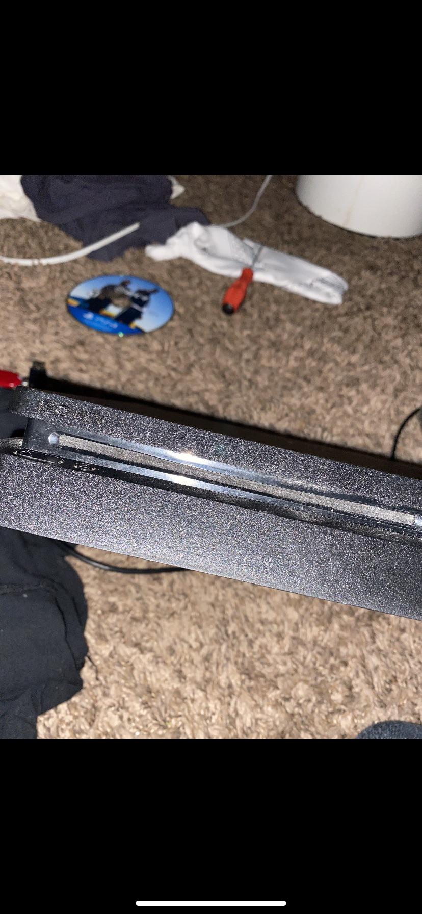 ps4 disc tray bent and not coming out ( makes knocking noise ) r