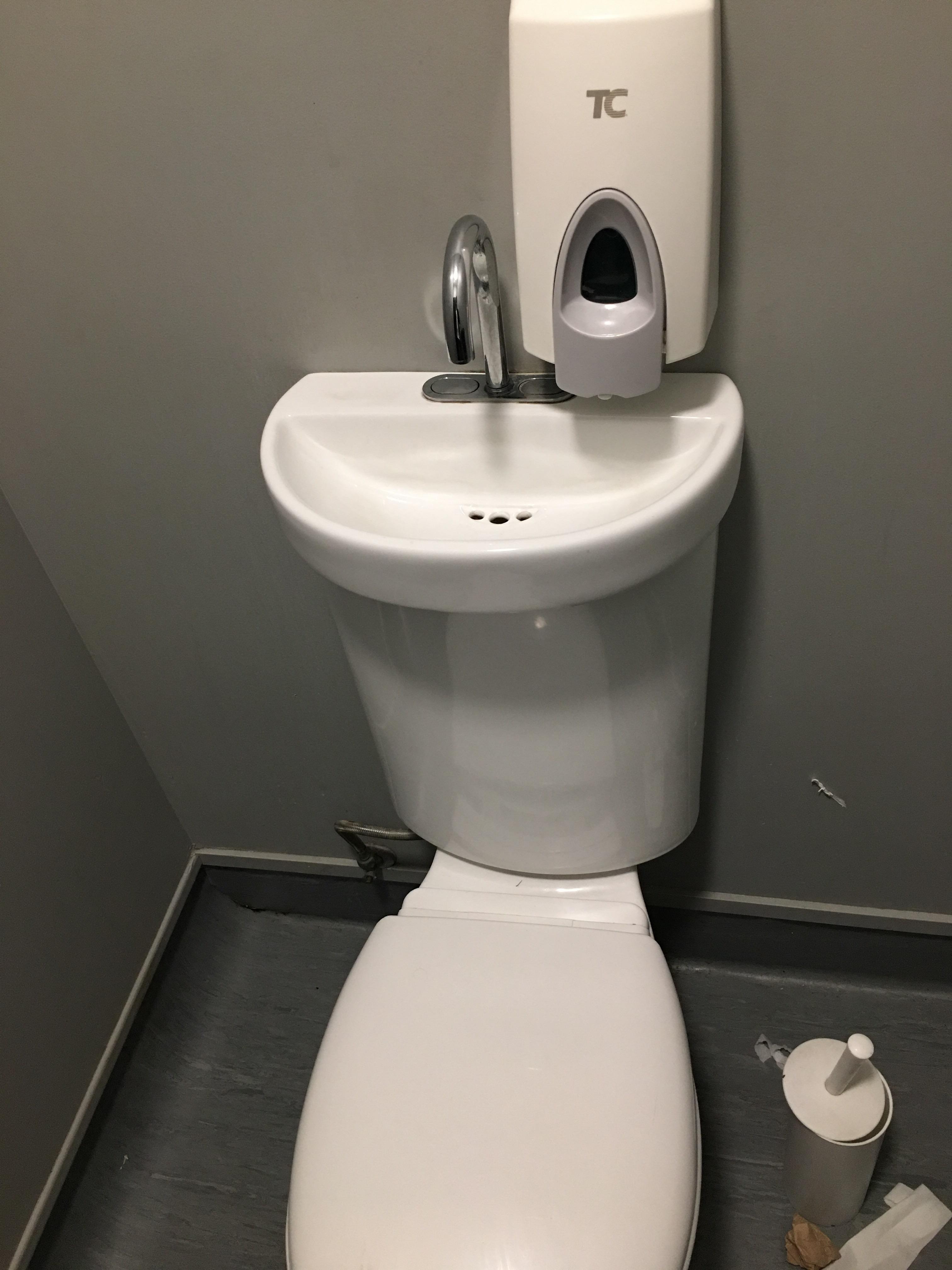 This toilet has a hand basin integrated into its cistern r