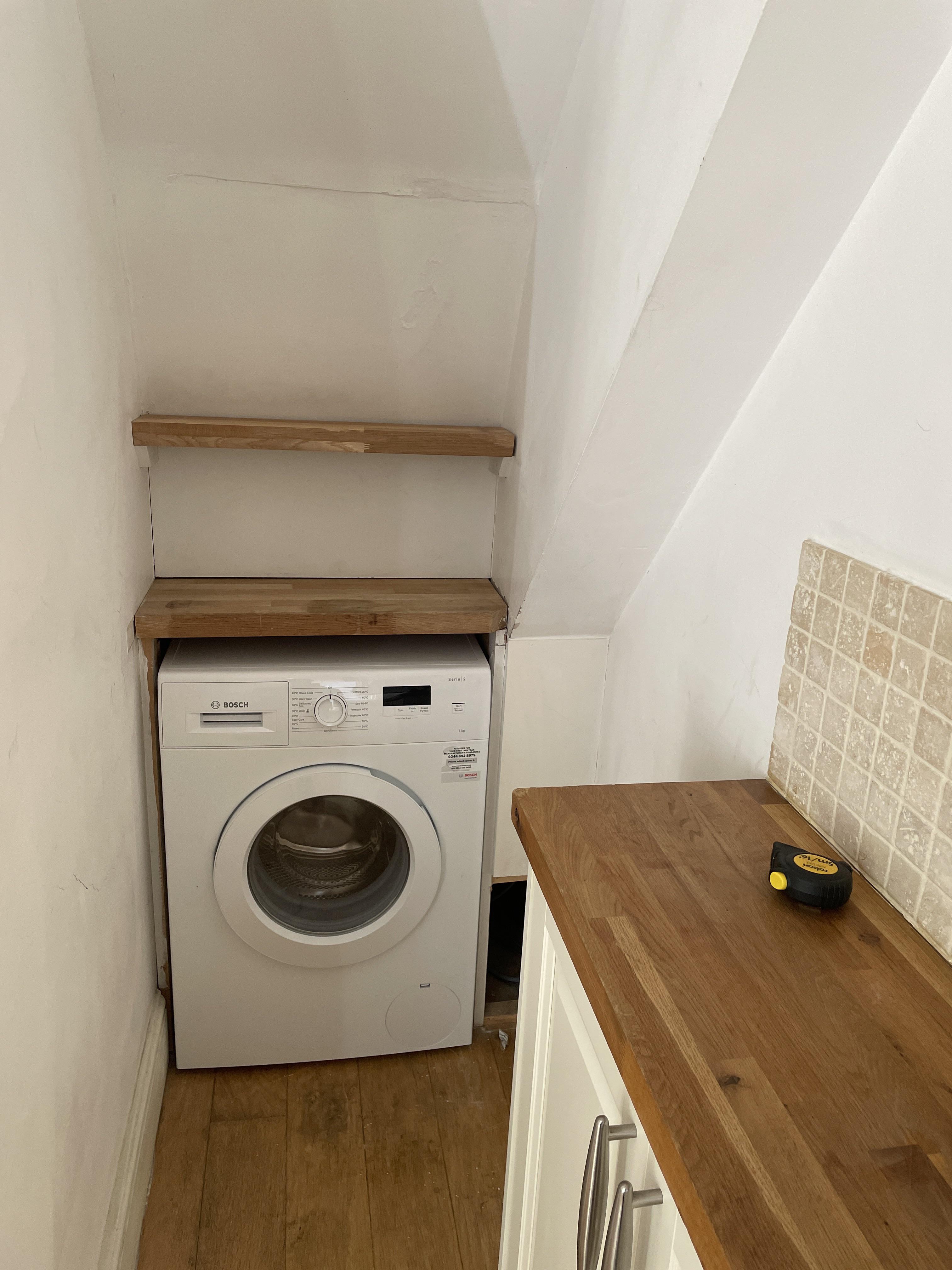 How can I lift and remove this washing machine? The only way out is by lifting it above the