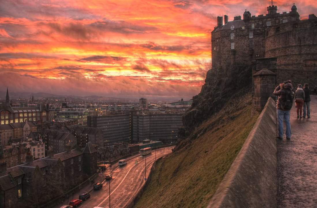 Edinburgh Castle and the city below, glowing in a beautiful sunset. r