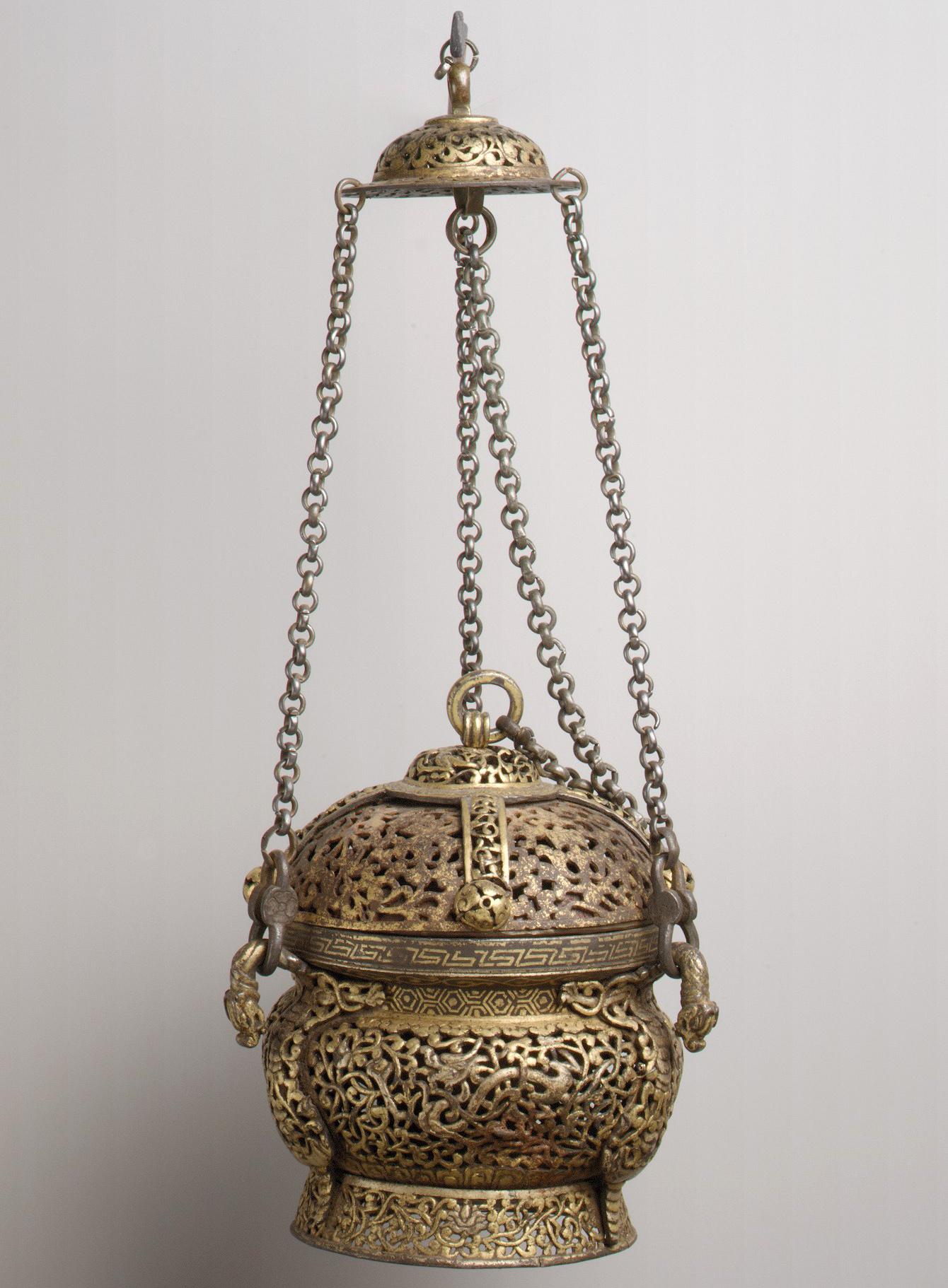Iron ritual incense burner with gilded openwork motifs. Tibet, 15th