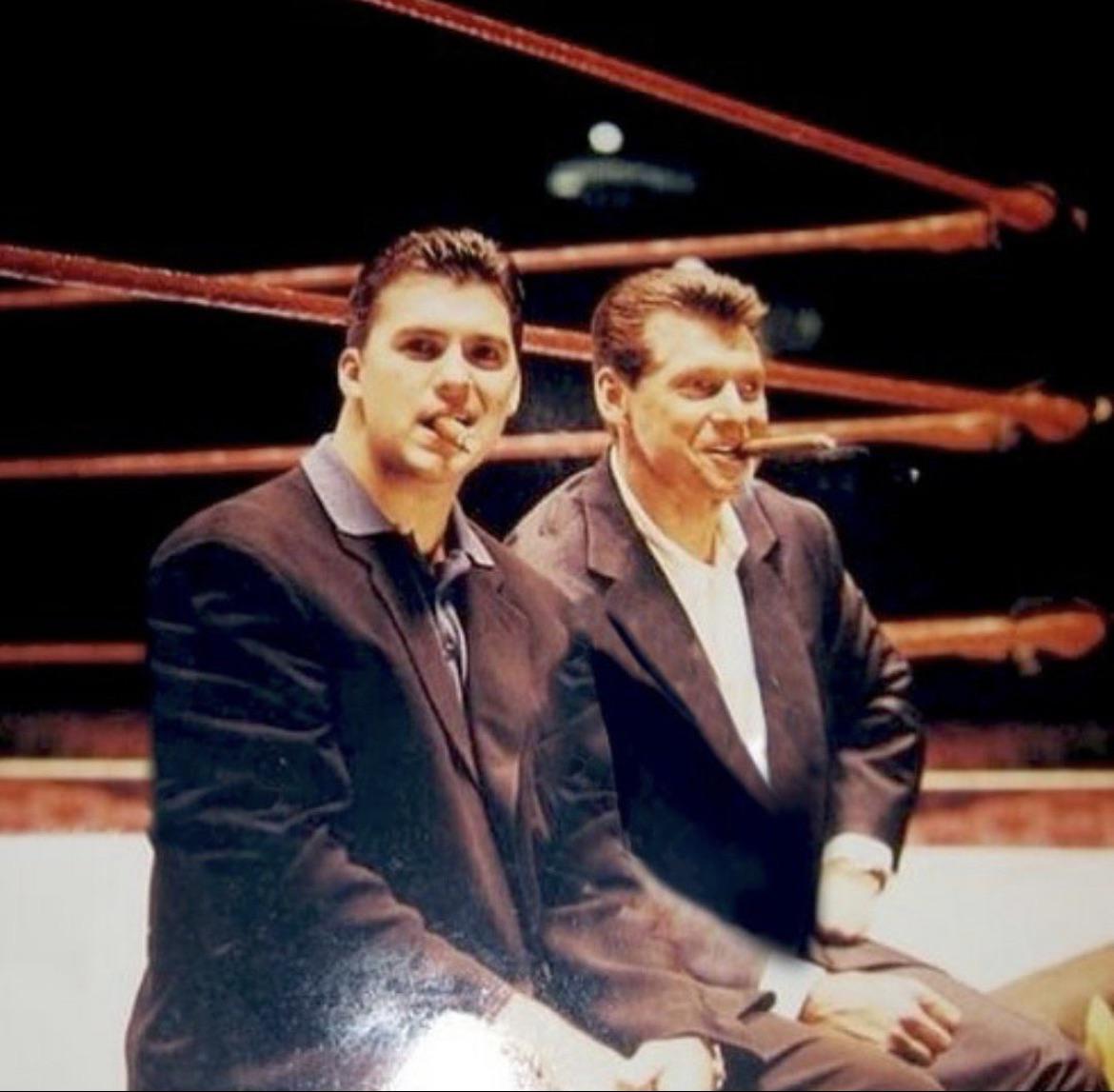 Old pic of Shane and Vince McMahon at a WWE house show, smoking cigars