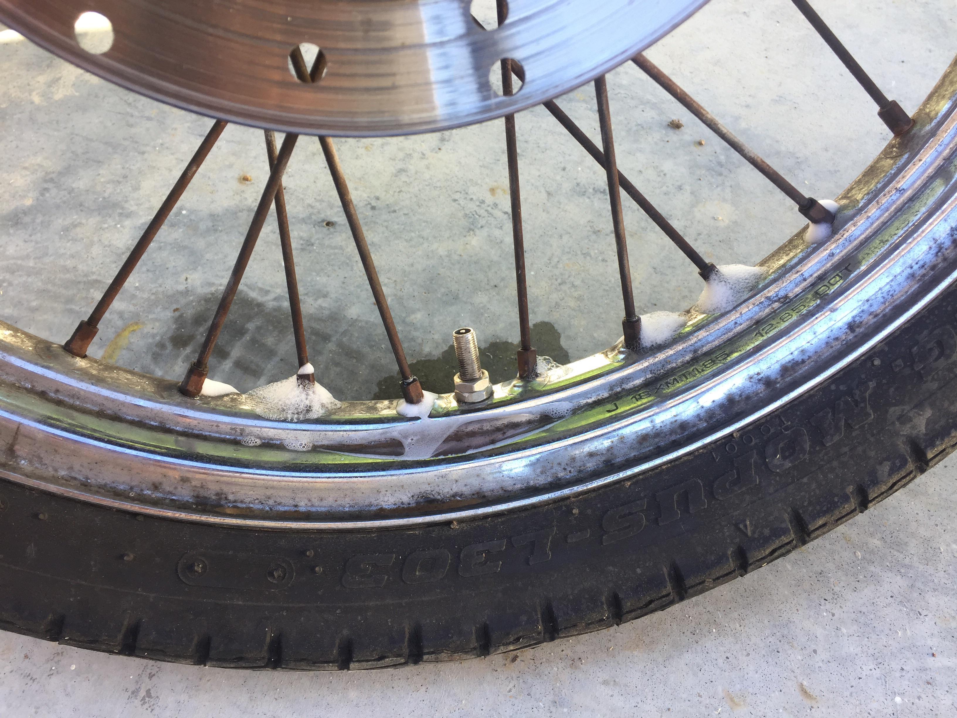 Air leaking from spoke holes. 1986 Honda Rebel 250cc front tire. Fix