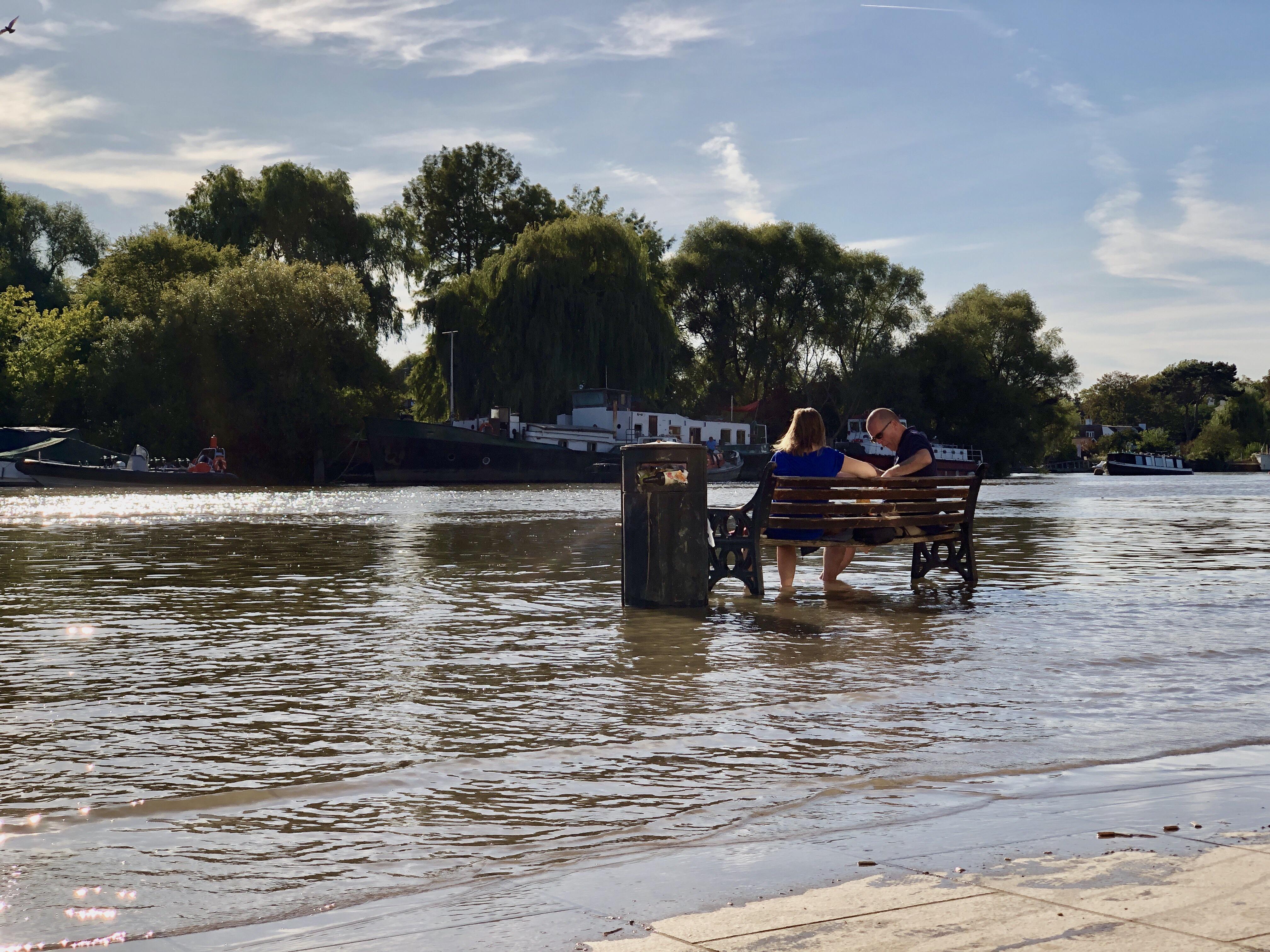 A couple refusing to let rising water ruin their nice sit down r/CasualUK
