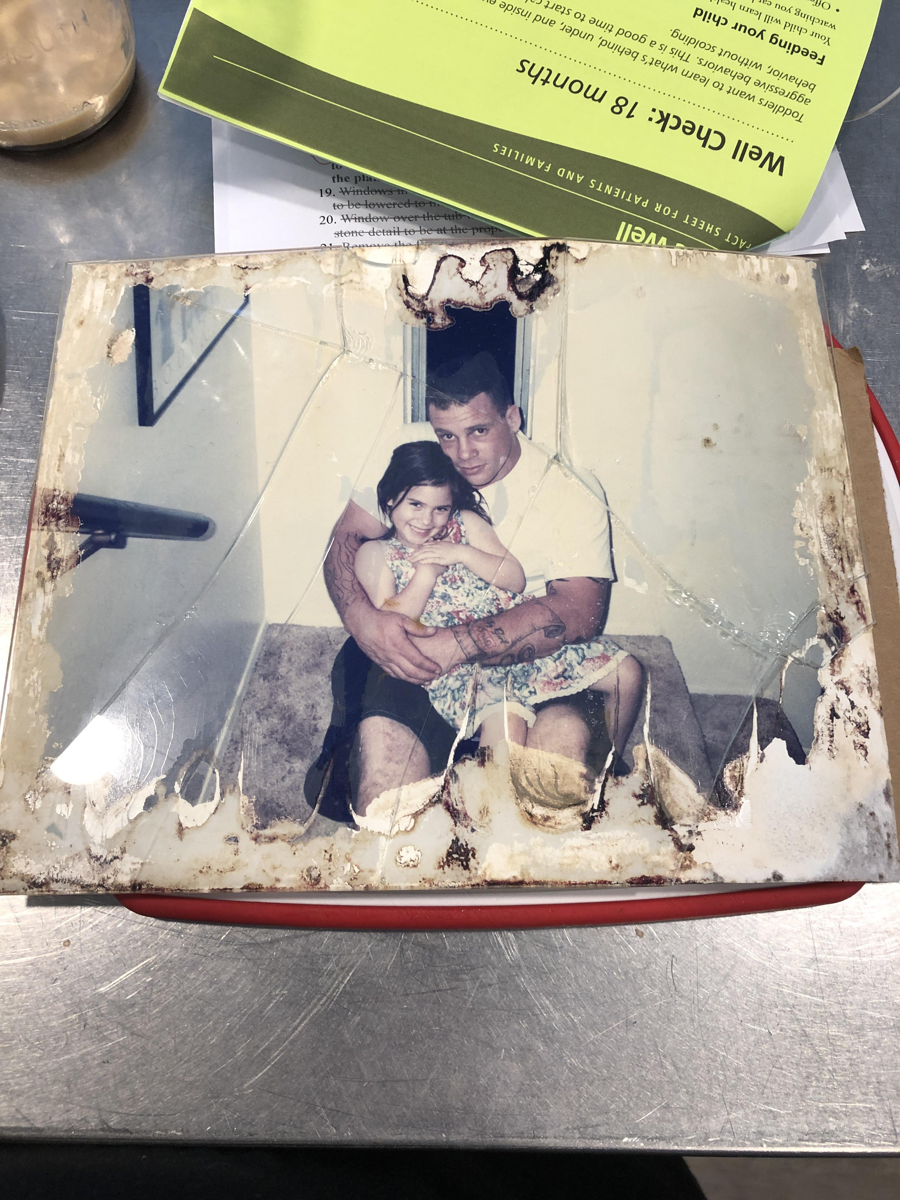 How do I salvage this photo of my dad and I (picture stuck to glass and