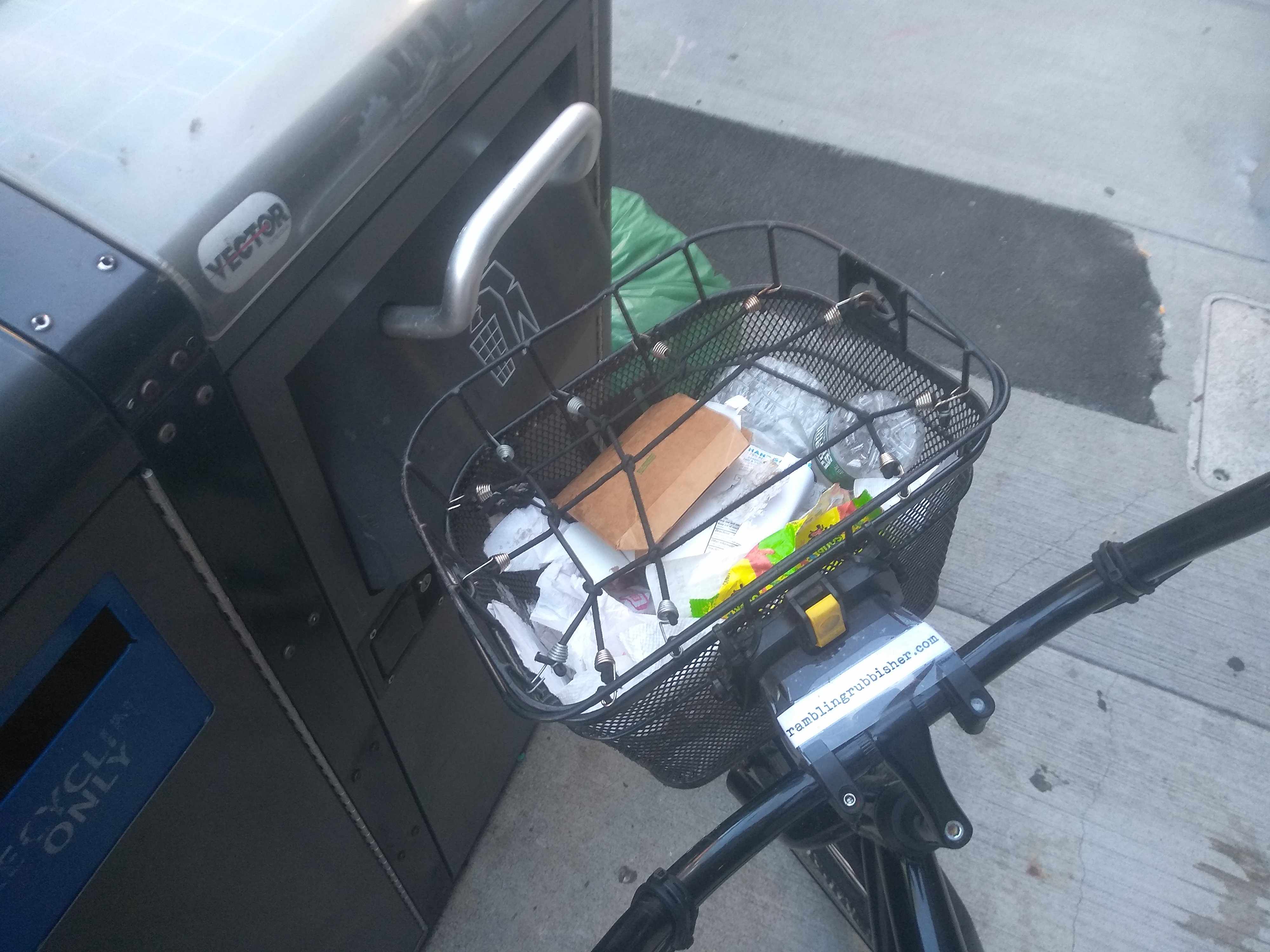 Just another bicycle basket of trash picked on a 6.1 mile ride through