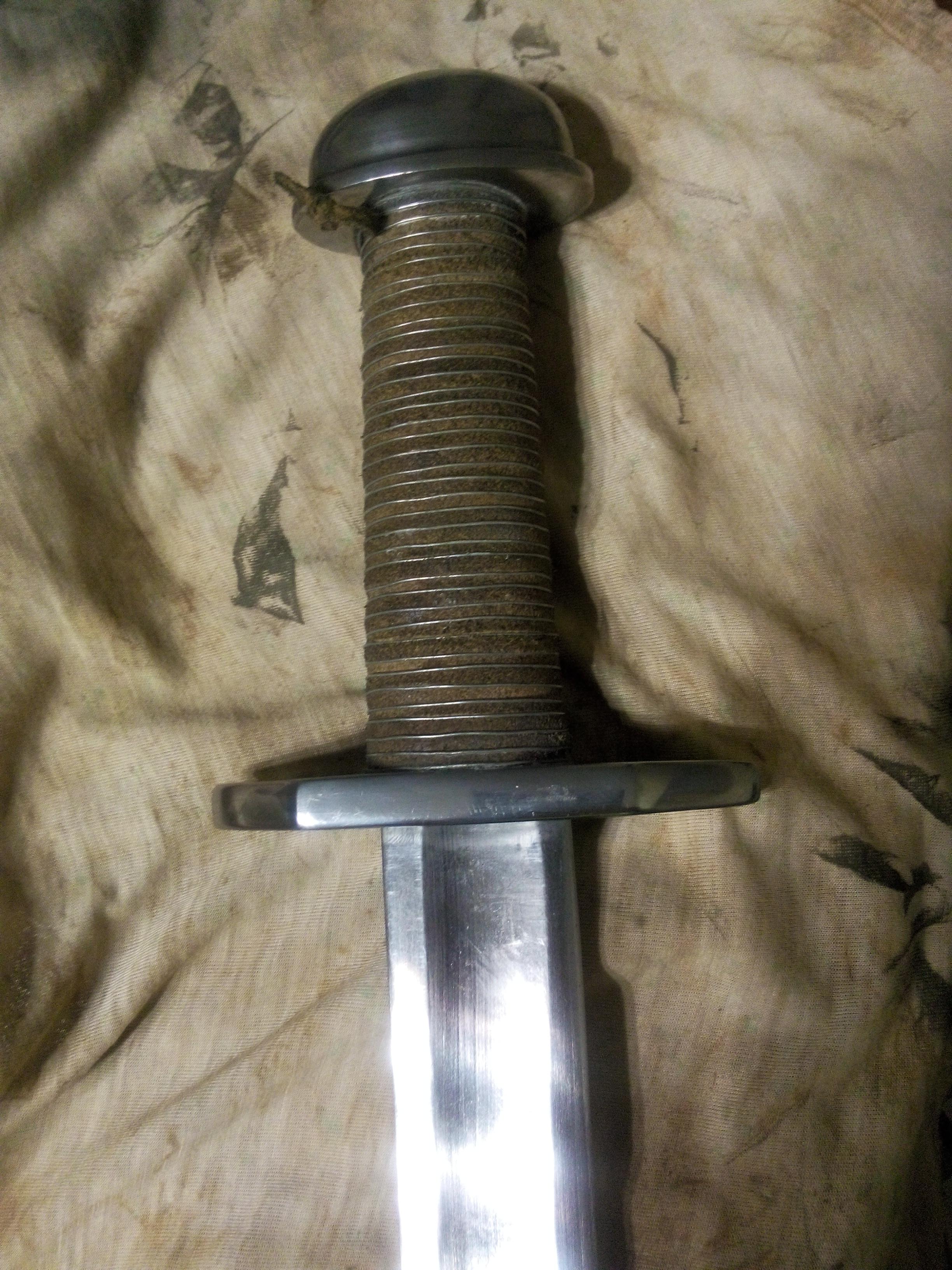 Today I did a wire wrap mod to my hilt. I hope it looks good. r/SWORDS