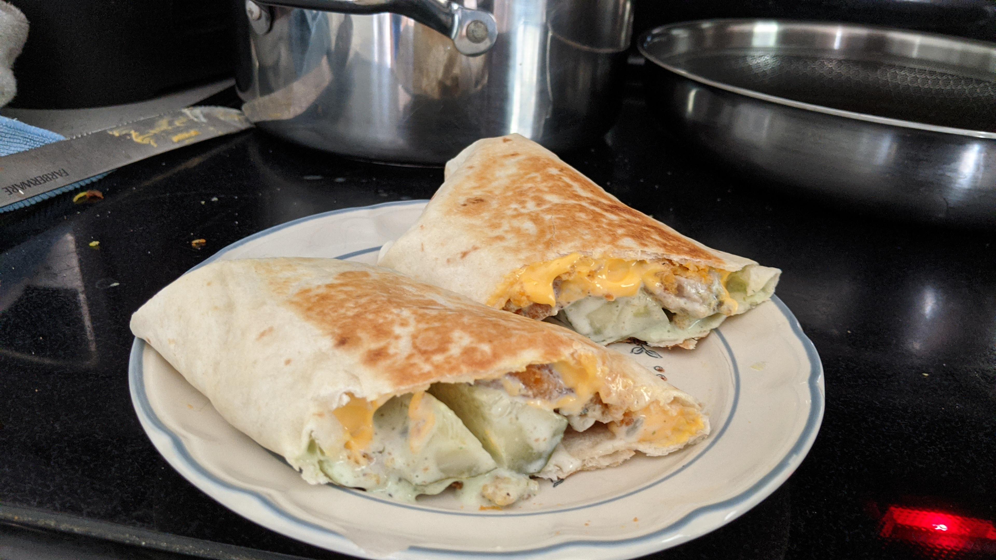 Microwaved chicken nuggets in a burrito with ranch, dill pickle, and