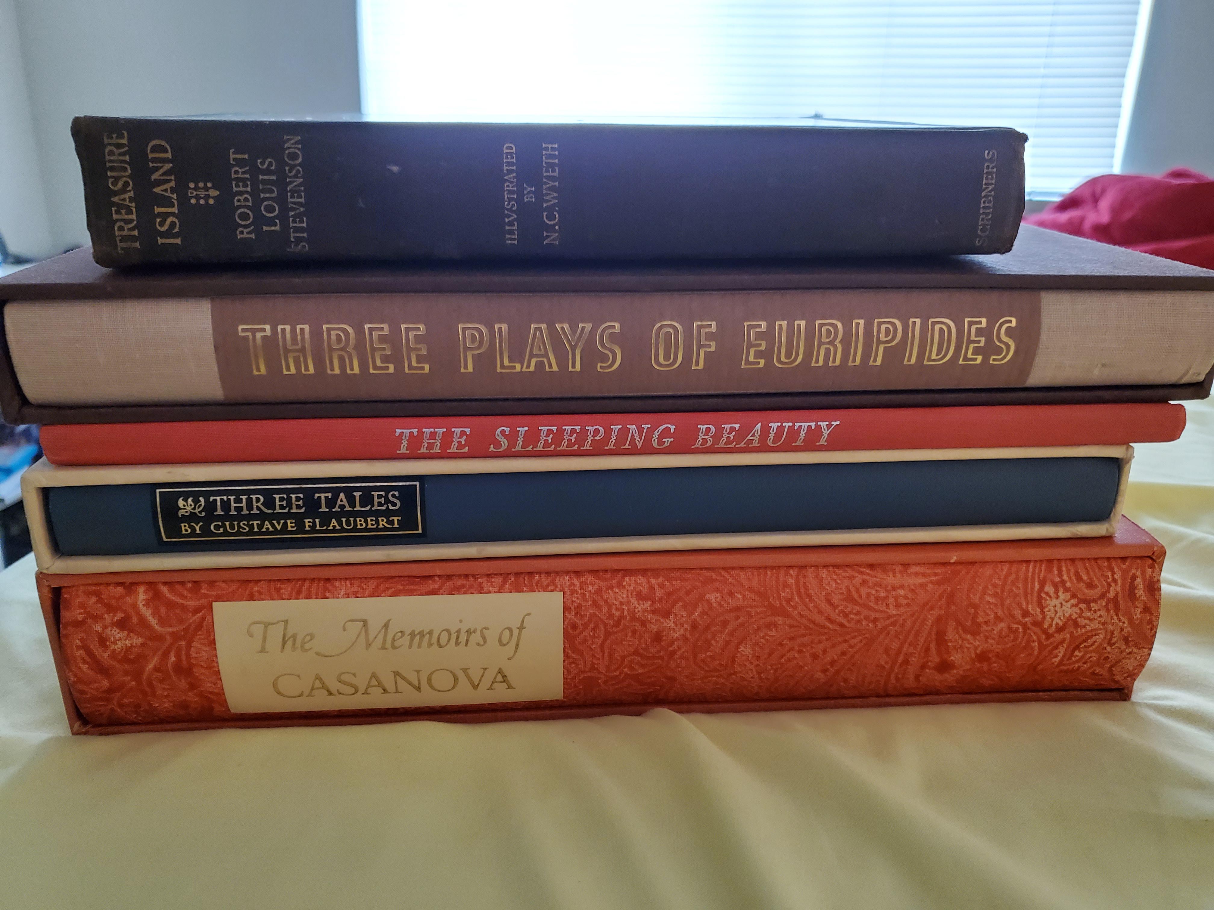 Four Limited Editions Club books plus a 1911 edition of Treasure Island