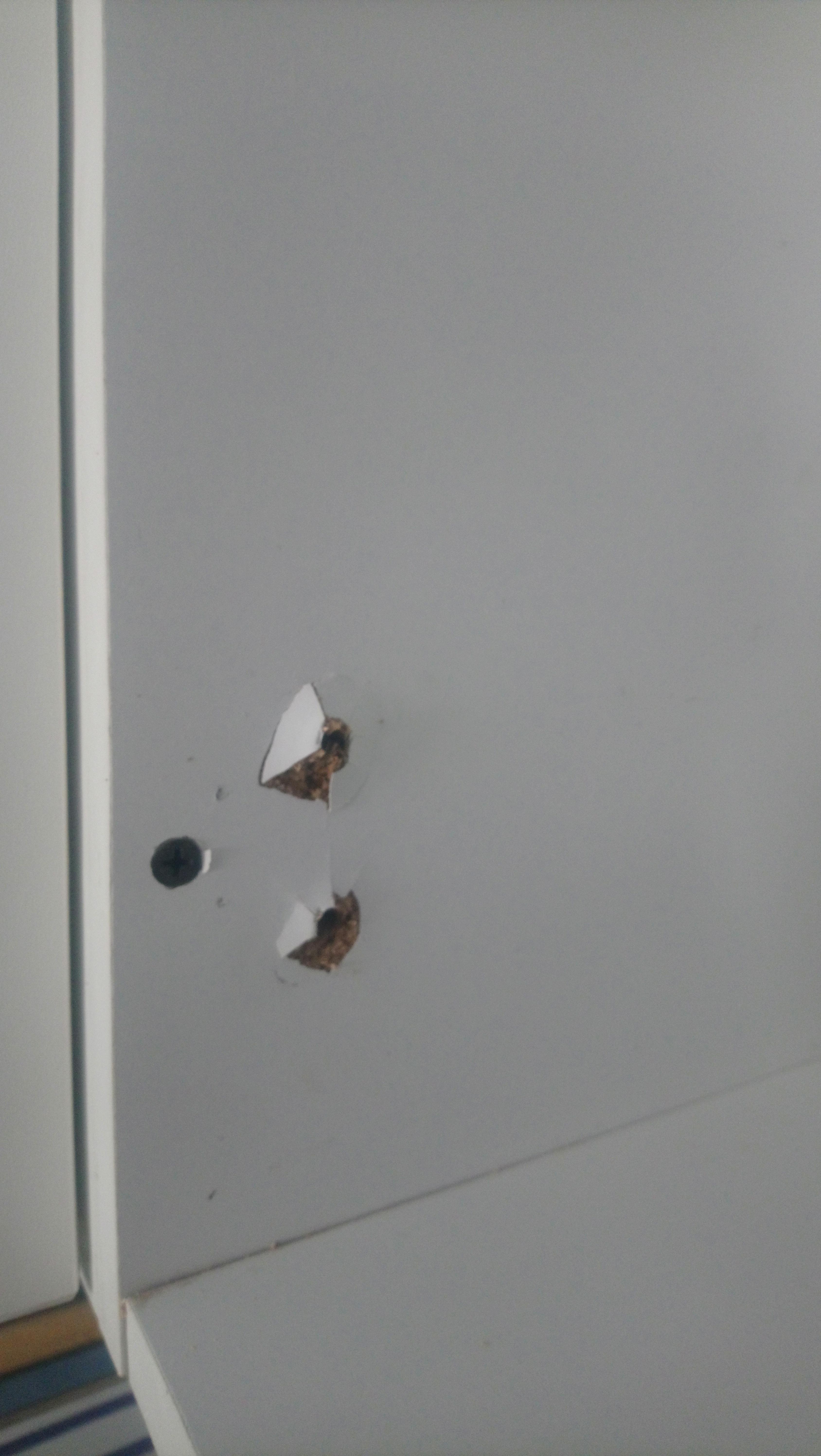 Kitchen door fell off ripping the unit where it was attached