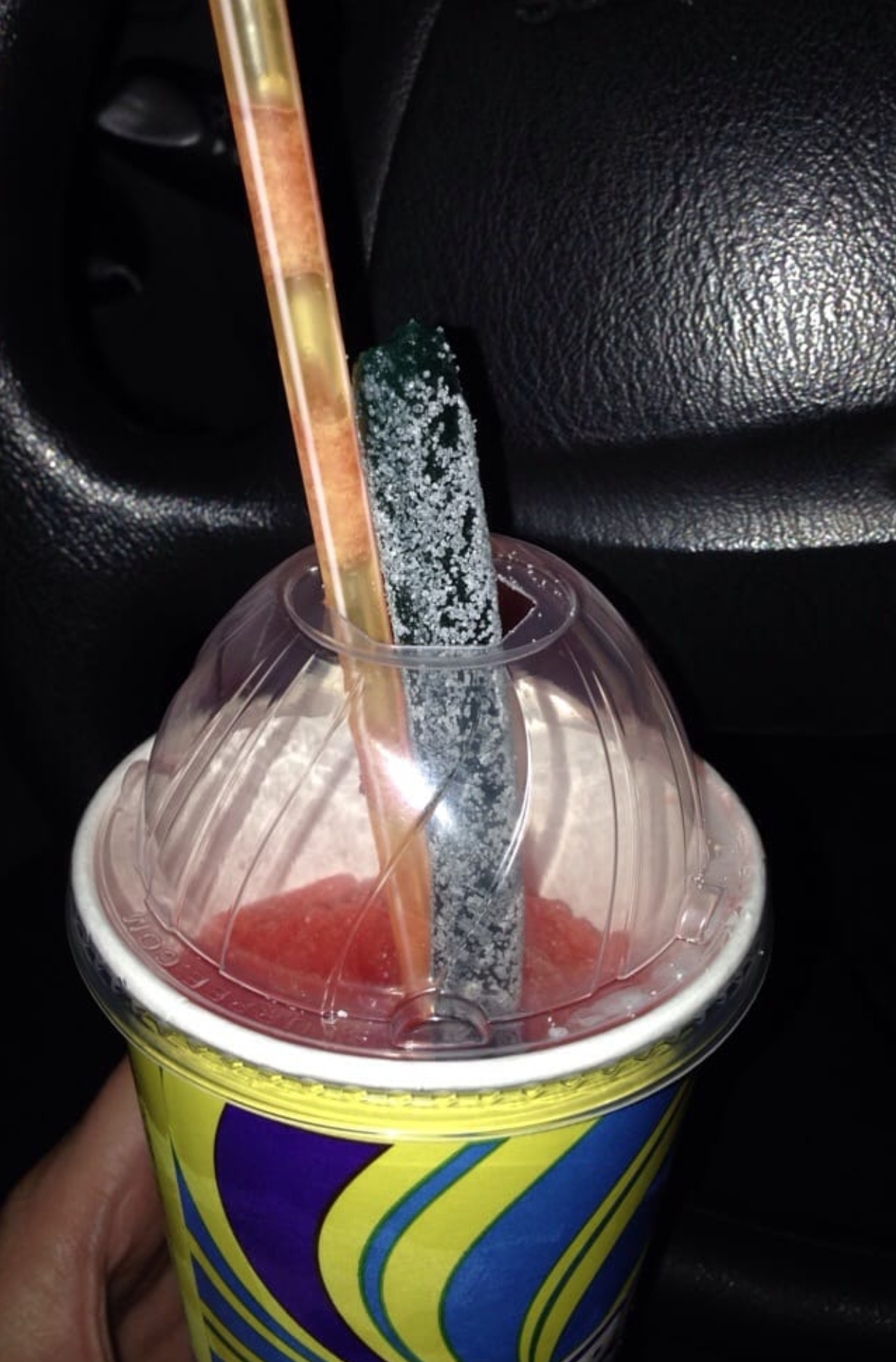 711's Big Sour Candy Straws. When you put it in your slurpee it'd