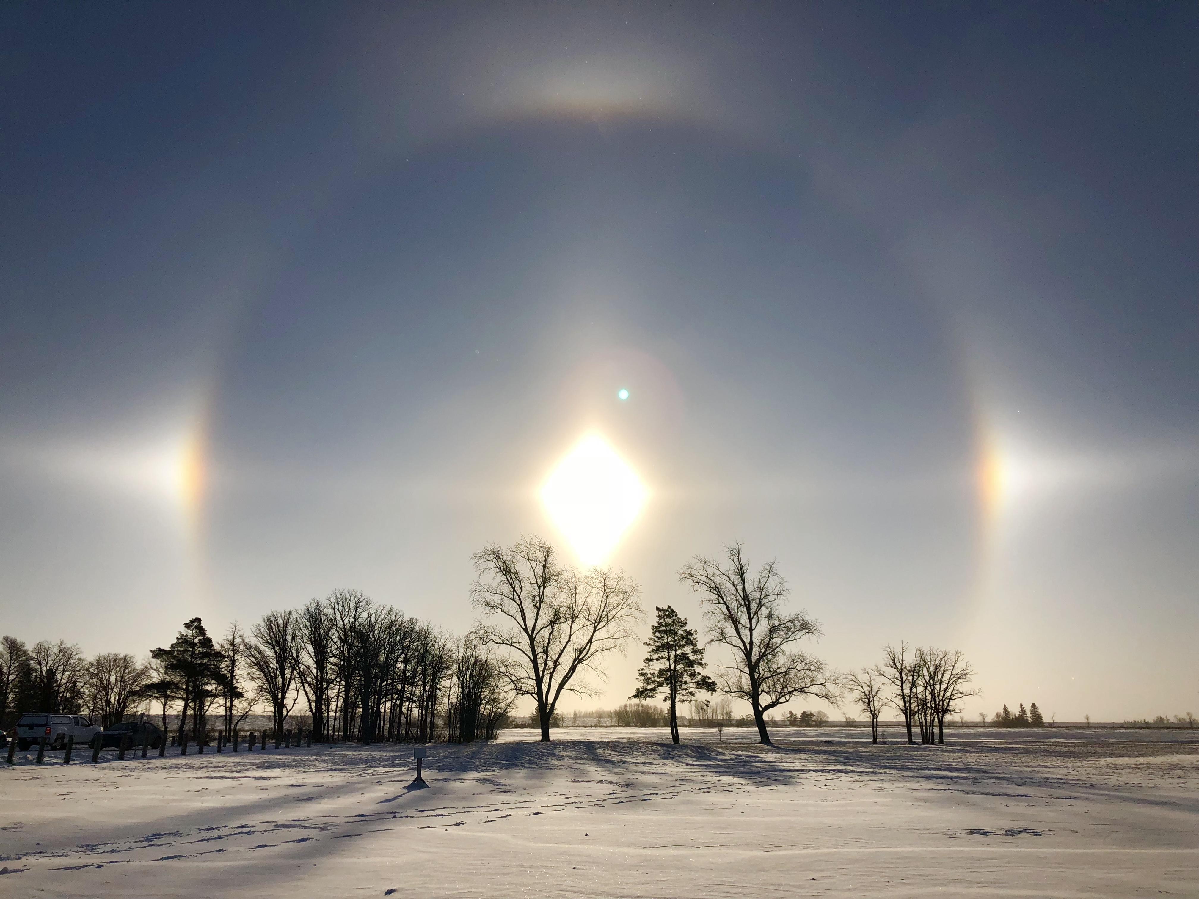 Refraction of sunlight off tiny ice crystals in the atmosphere causes