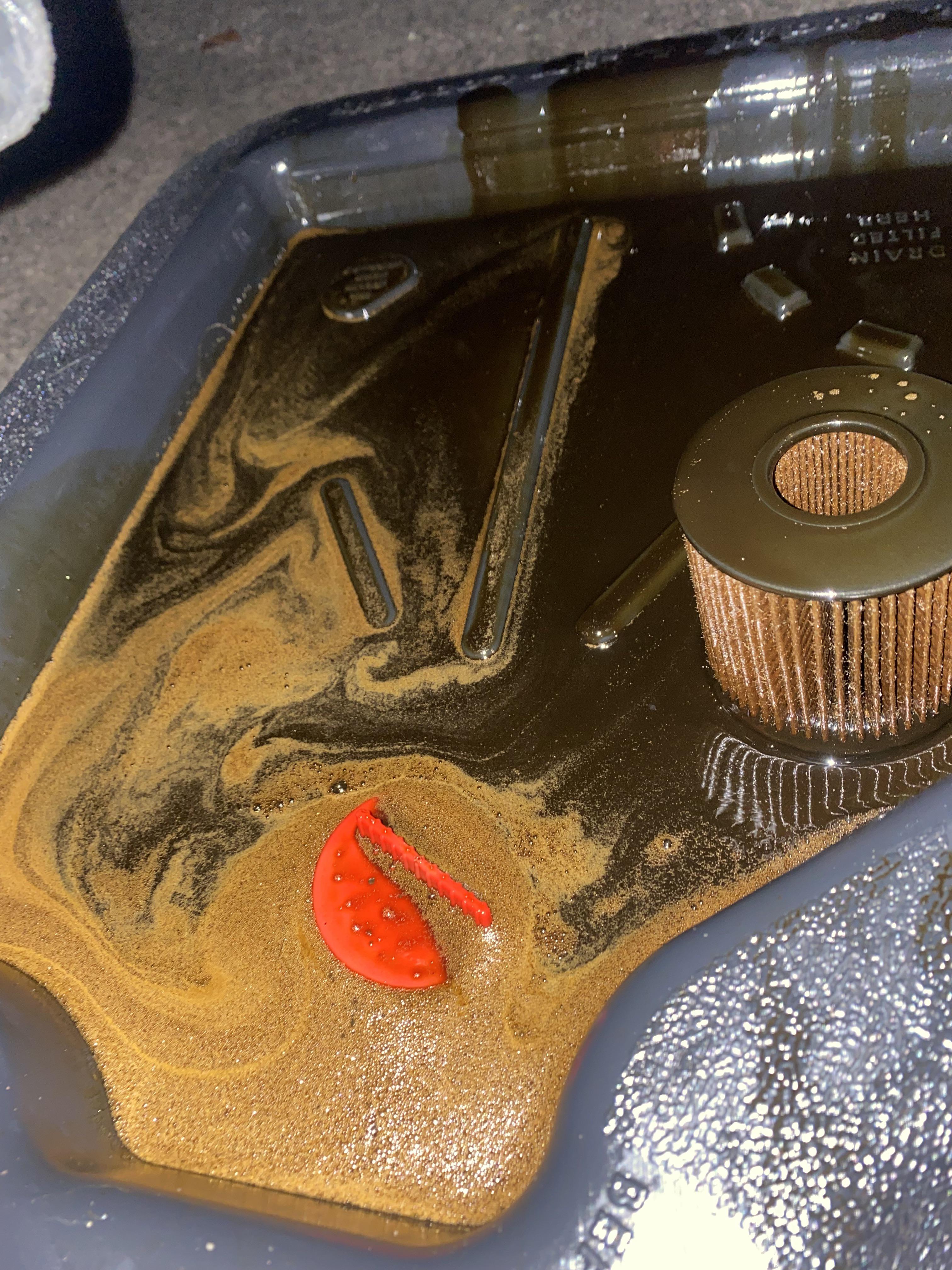 Changed my oil old oil looks bubbly r/MechanicAdvice