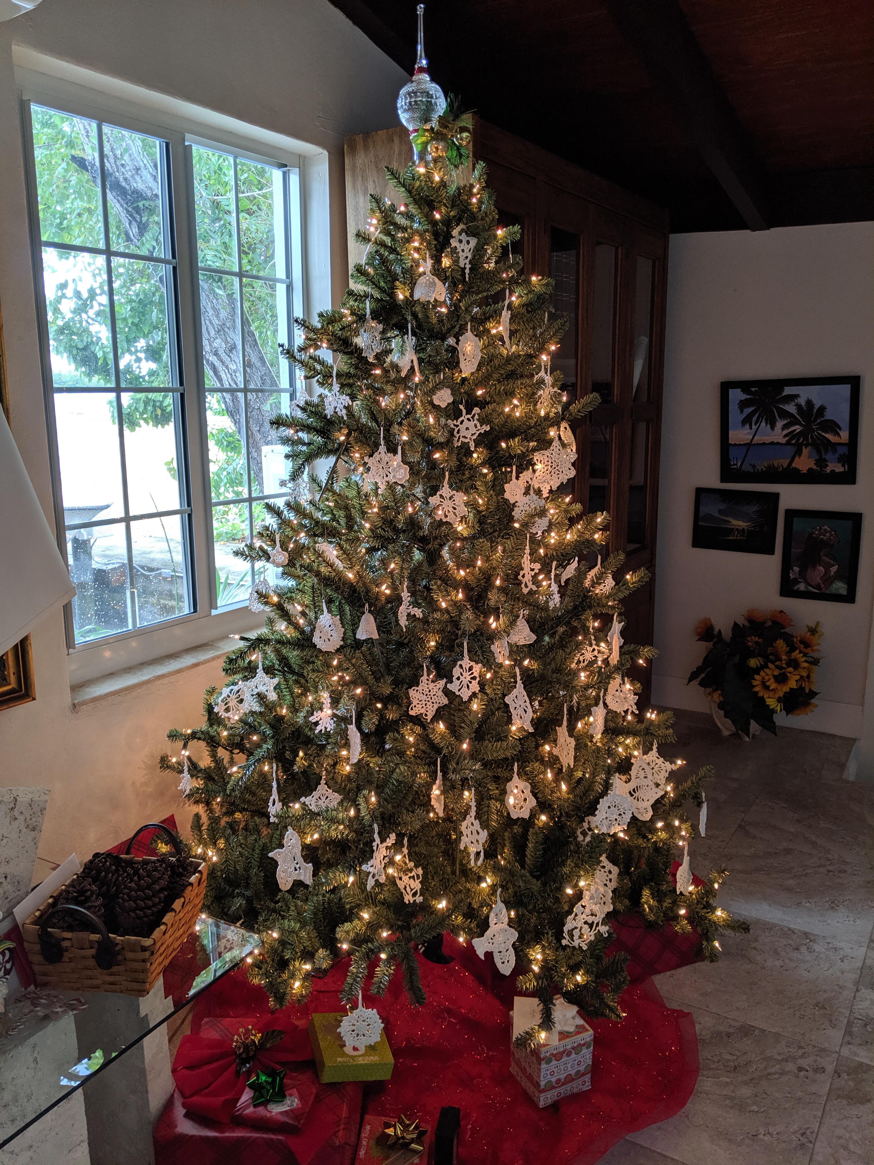 My Grandma's Christmas tree is decorated with all crocheted ornaments
