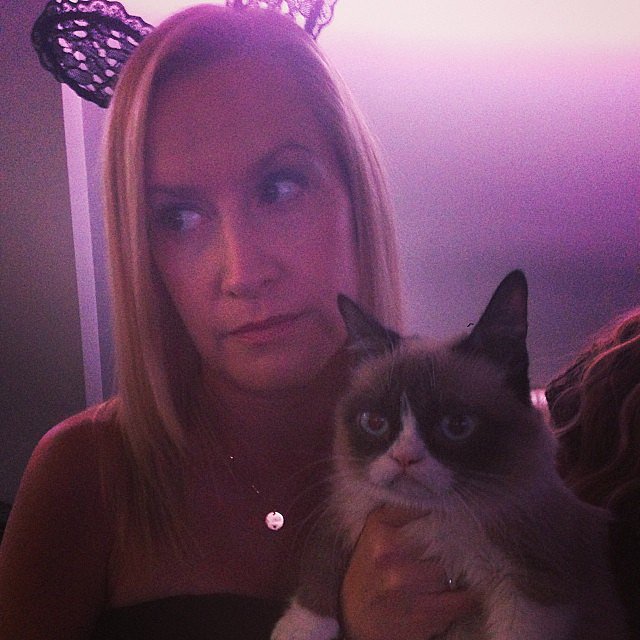 Angela from "The Office" with Grumpy Cat aww