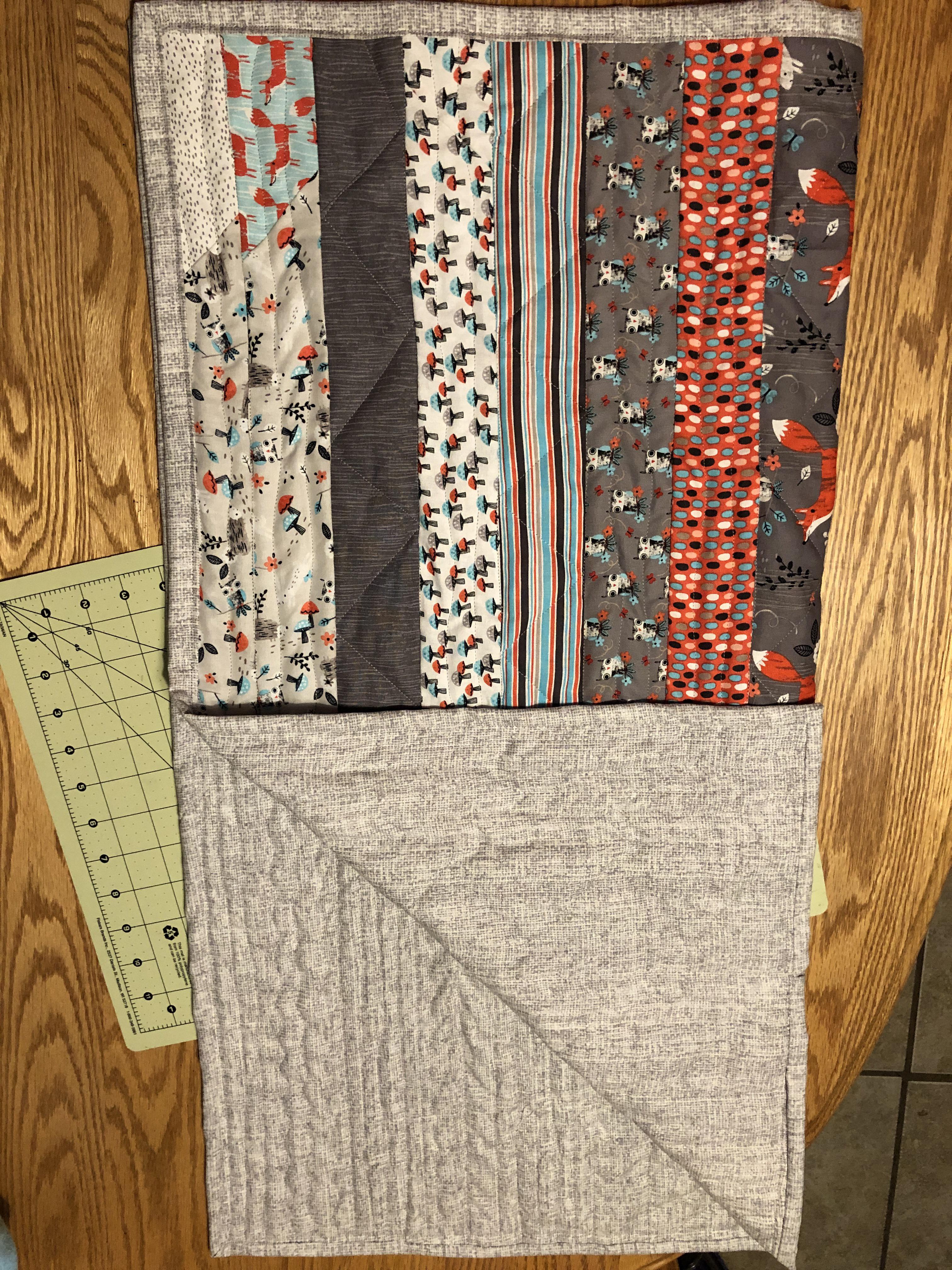 First completed quilt! I bound it backwards, and am HORRIBLE at basting