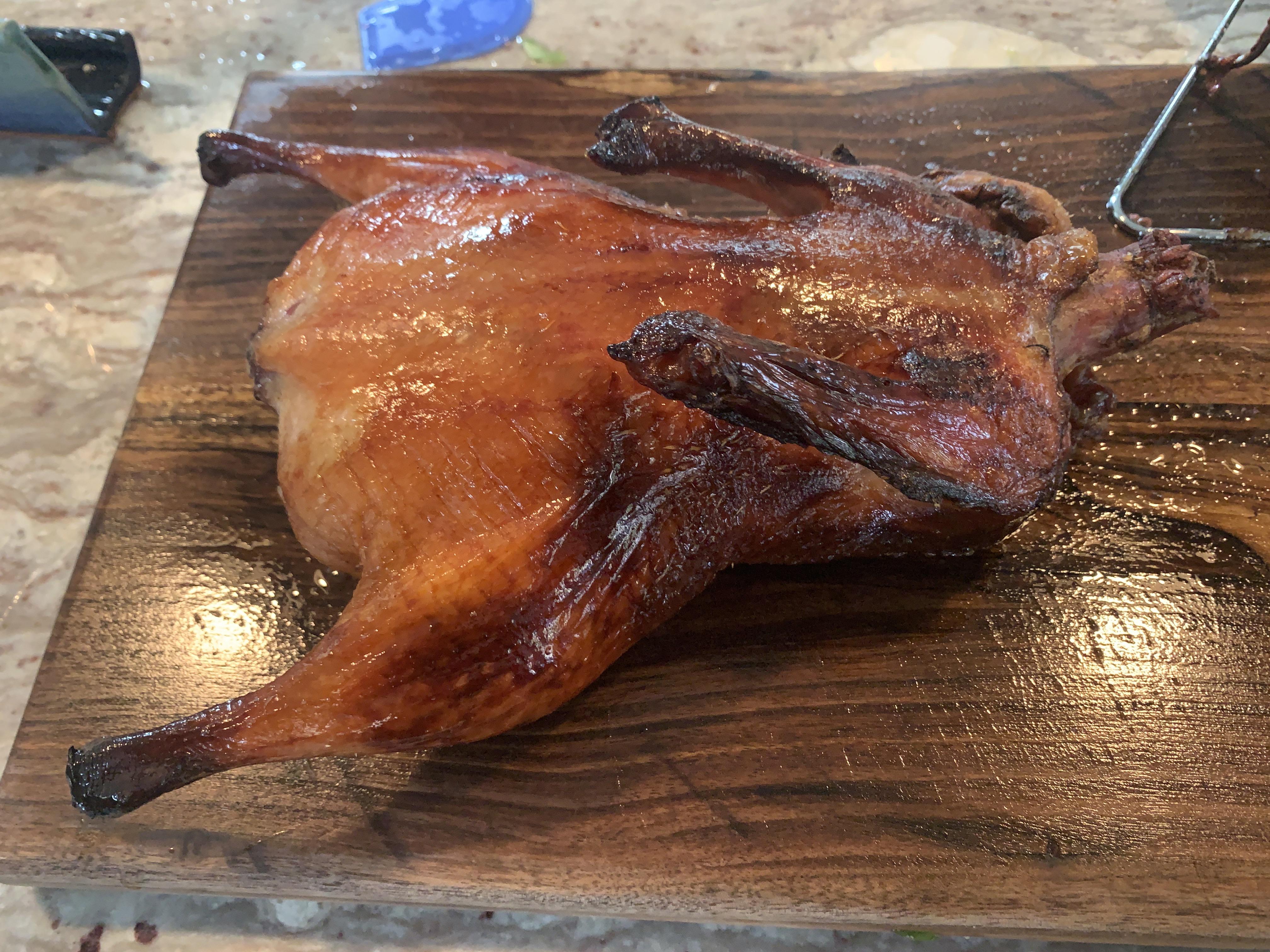 [Homemade] Peking duck cooked on a charcoal grill. Happy holidays