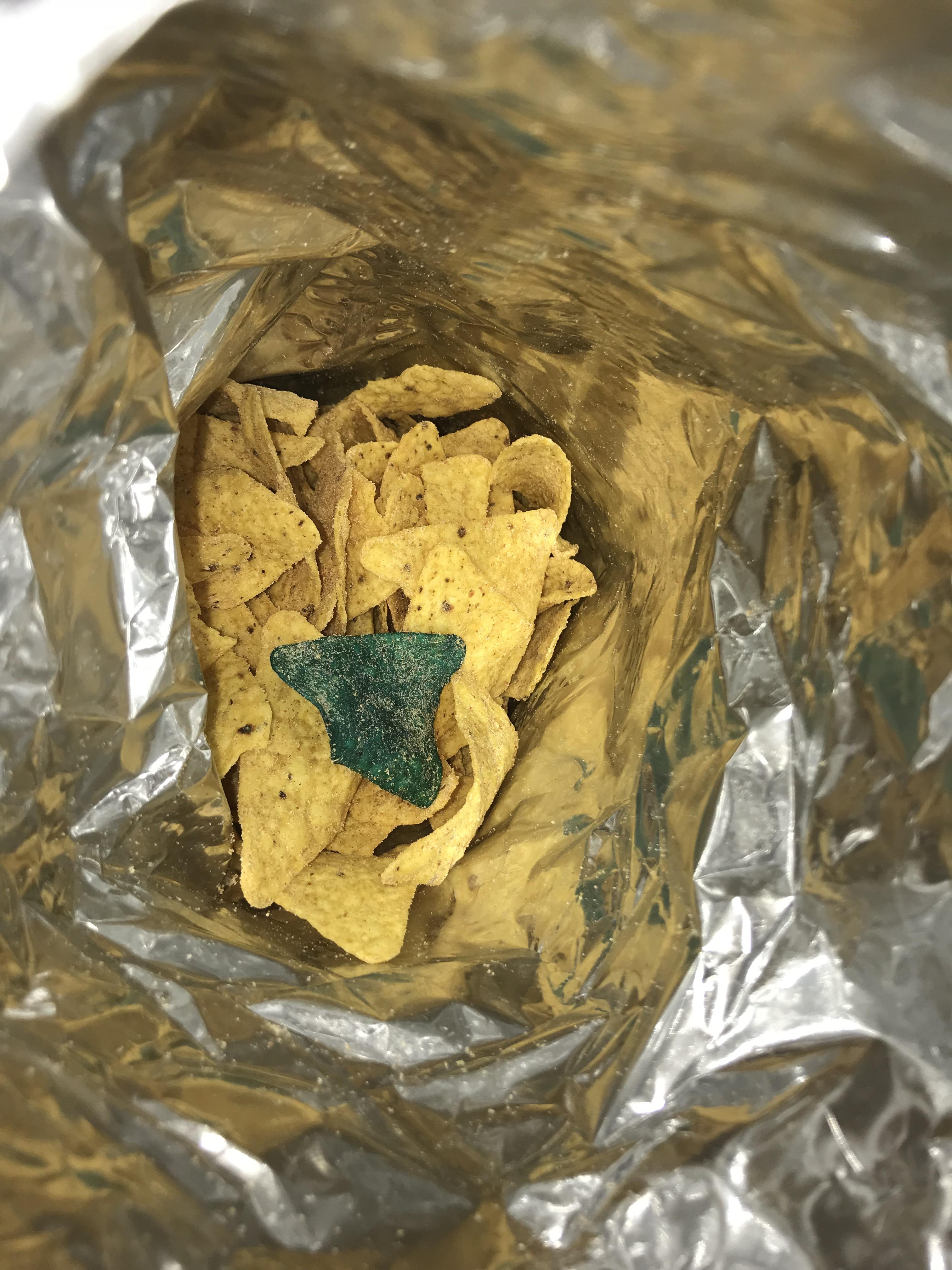 Found a green dorito in my cool American flavour bag. r/pics