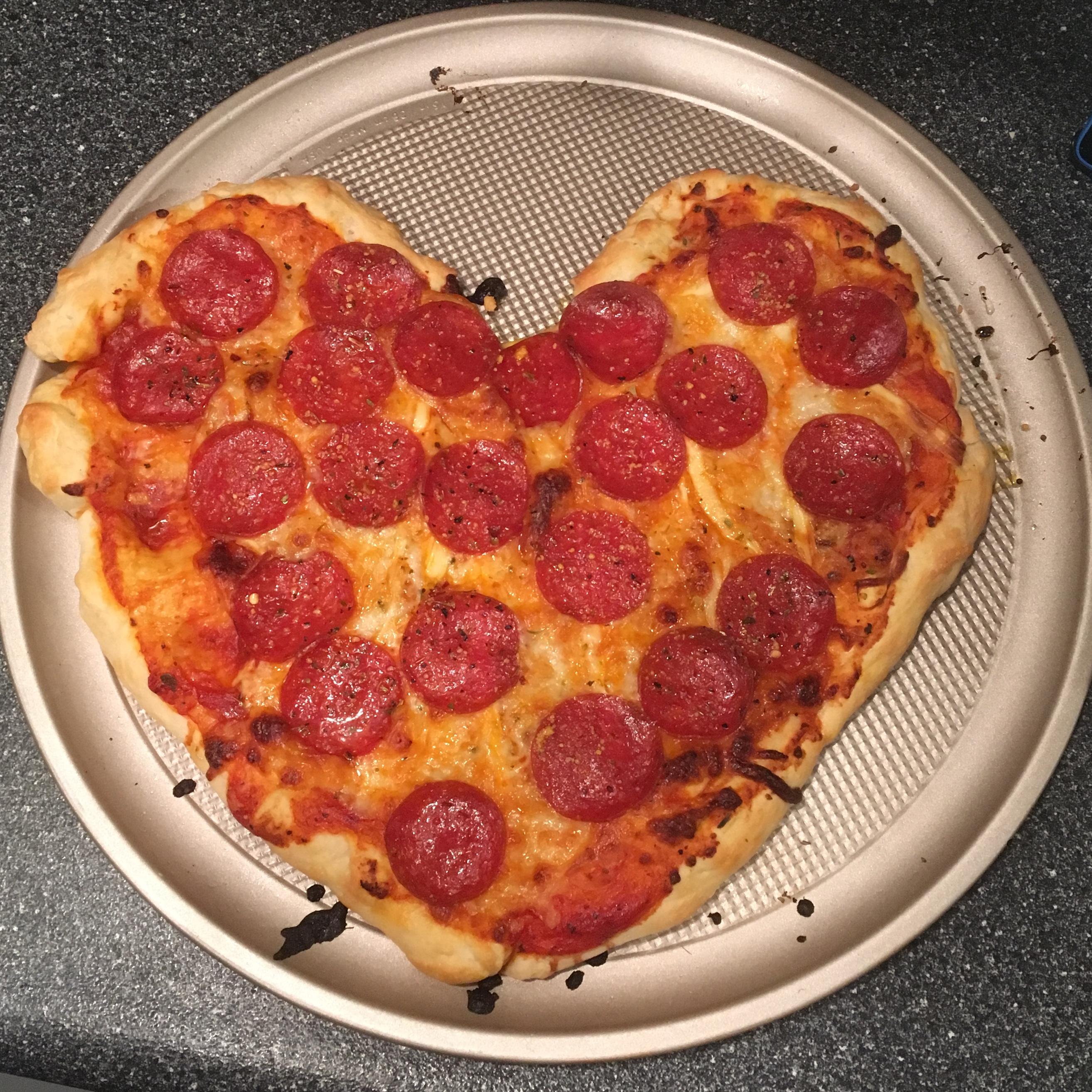 My girlfriend and I started a tradition of making heartshaped pizza on